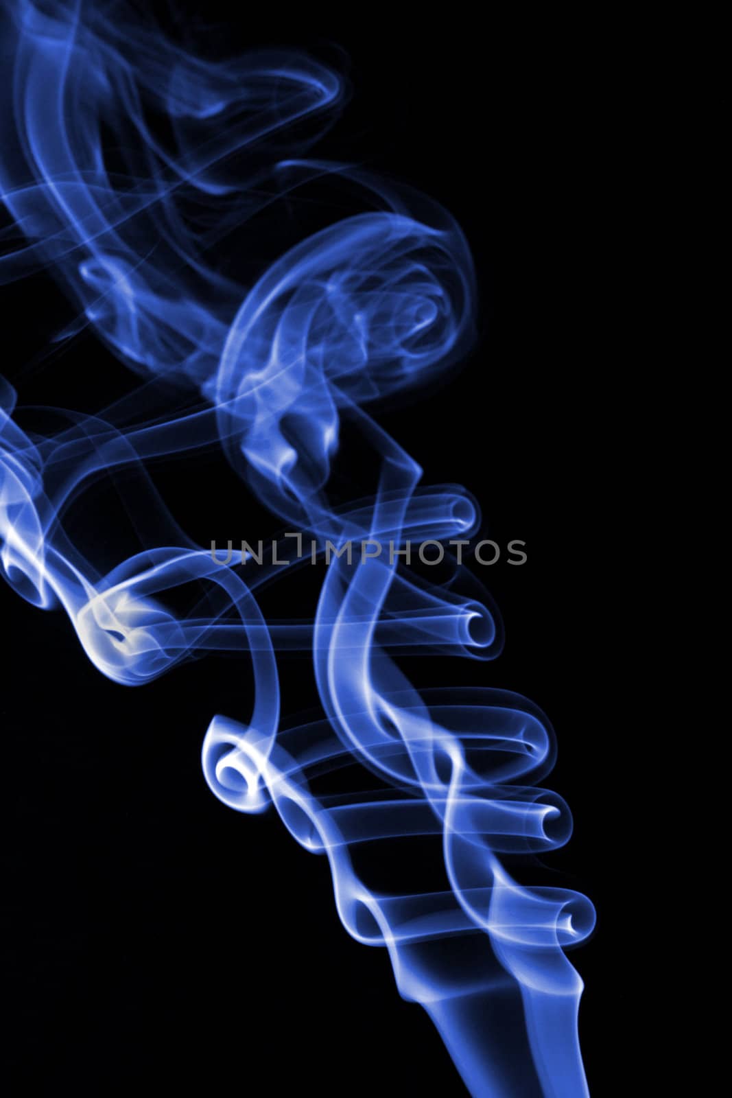 Abstract colored smoke isolated on black background