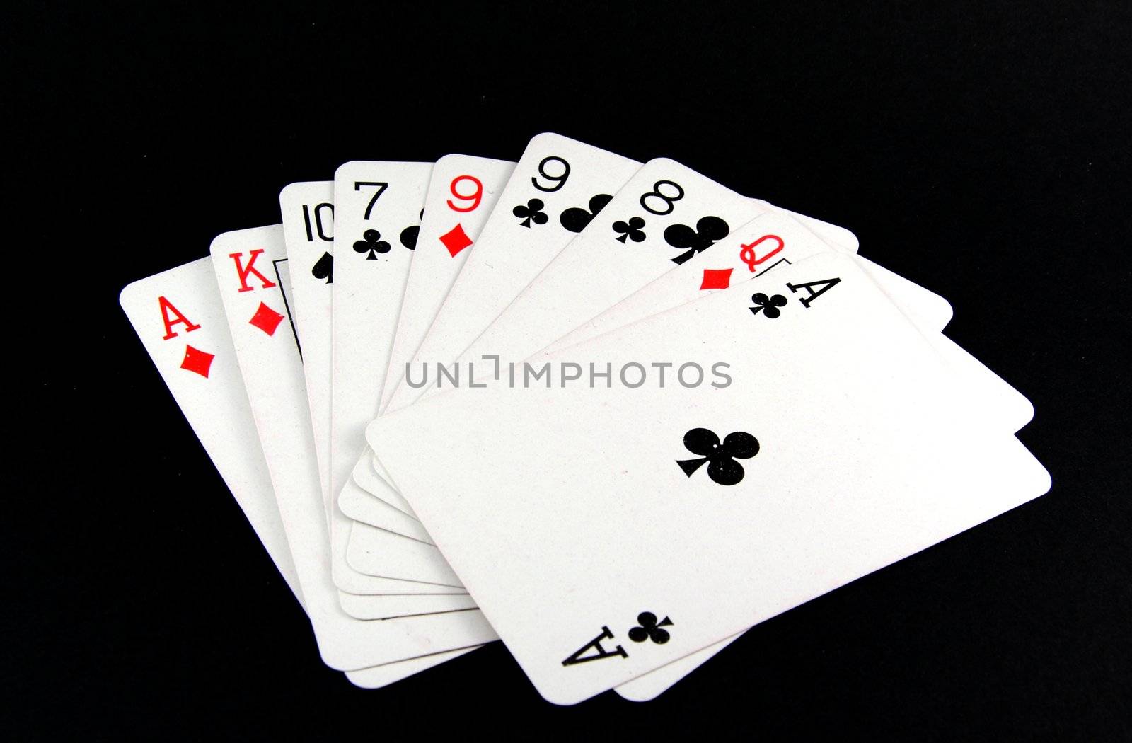 Playing cards on black background 