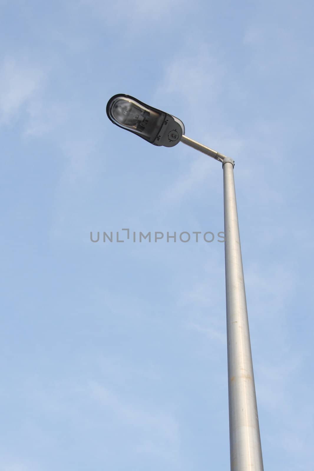 Street lamp against the blue sky 