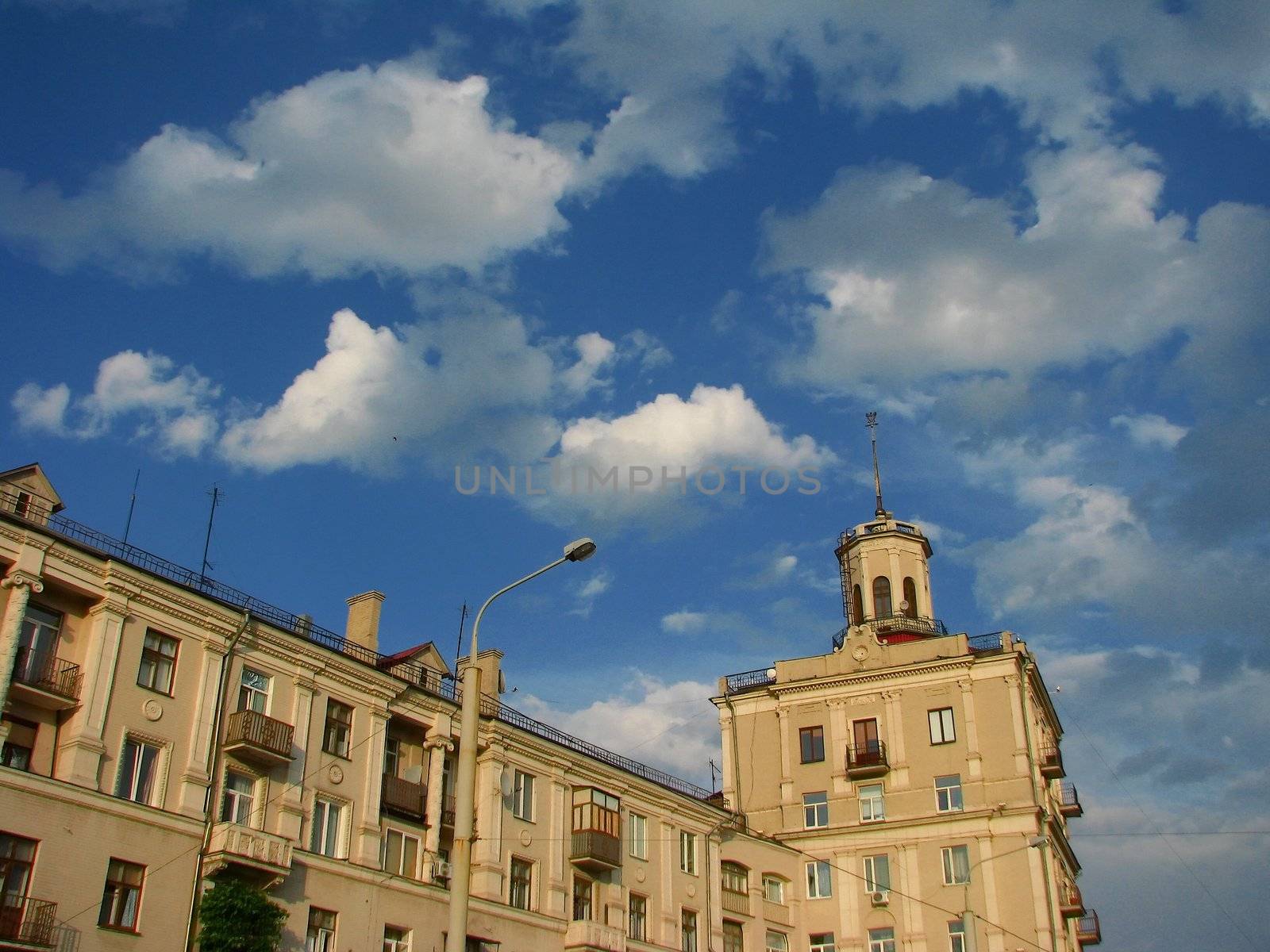 The house with a tower over the cloudy sky