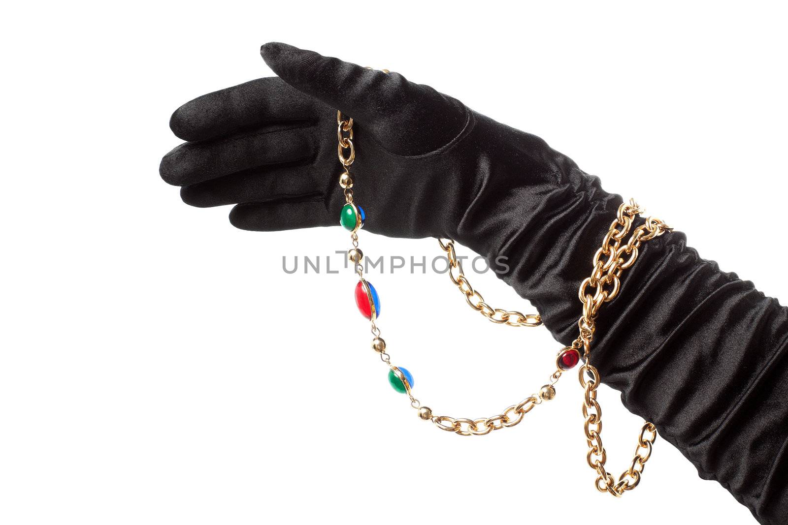 Sensual female hand in silk glove with golden necklace. Isolated over white background