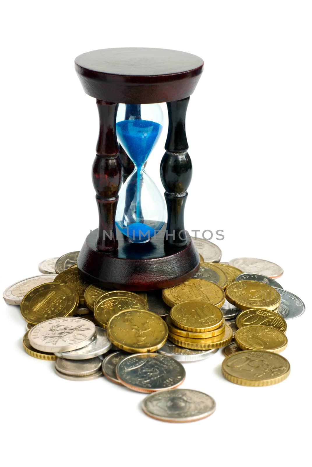 Time is money - sandglass and coins