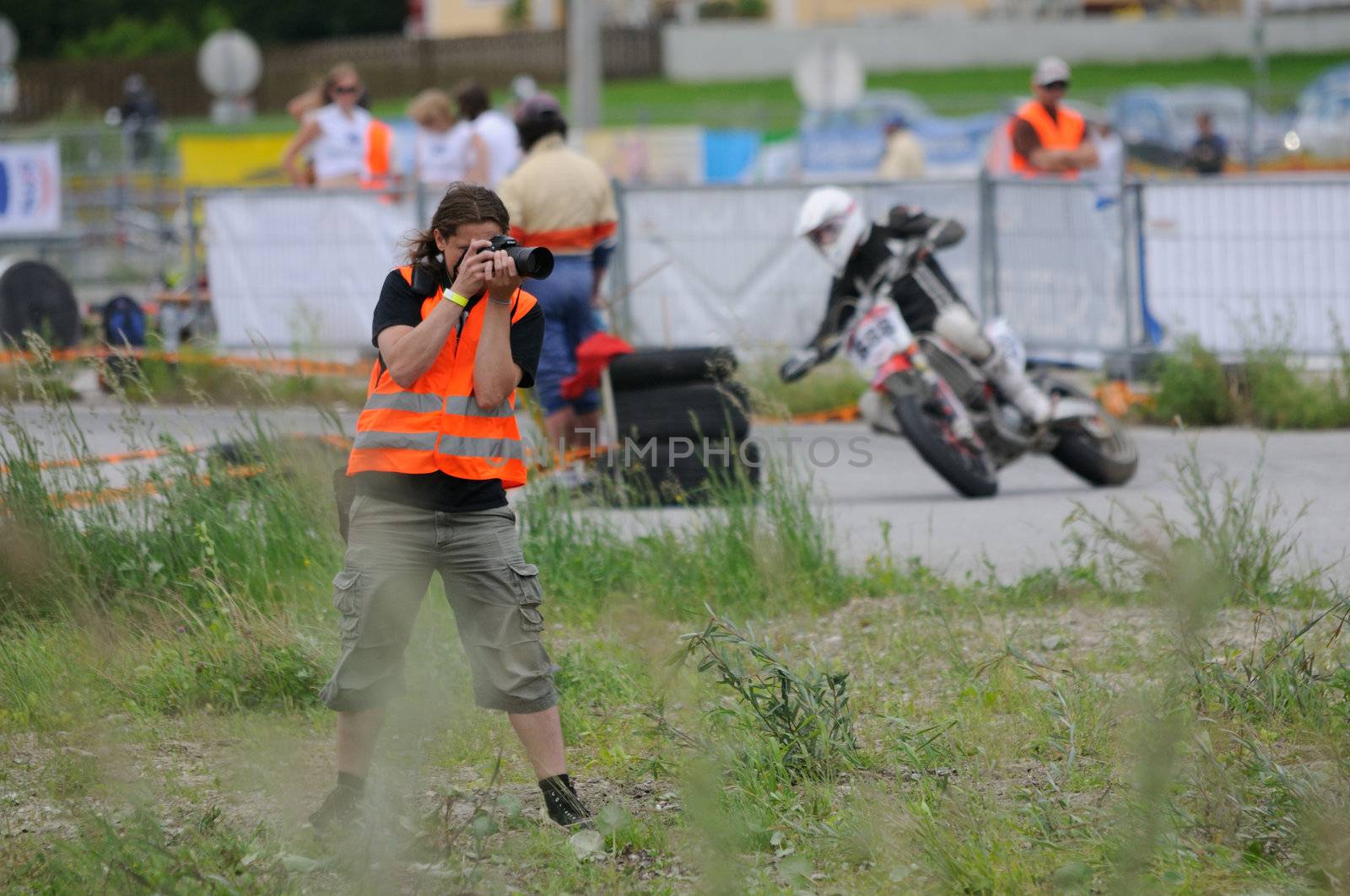 TAXENBACH, AUSTRIA - JUN 5: Supermoto trophy race. Photographer at the final race on June 5, 2011 in Taxenbach, Austria.