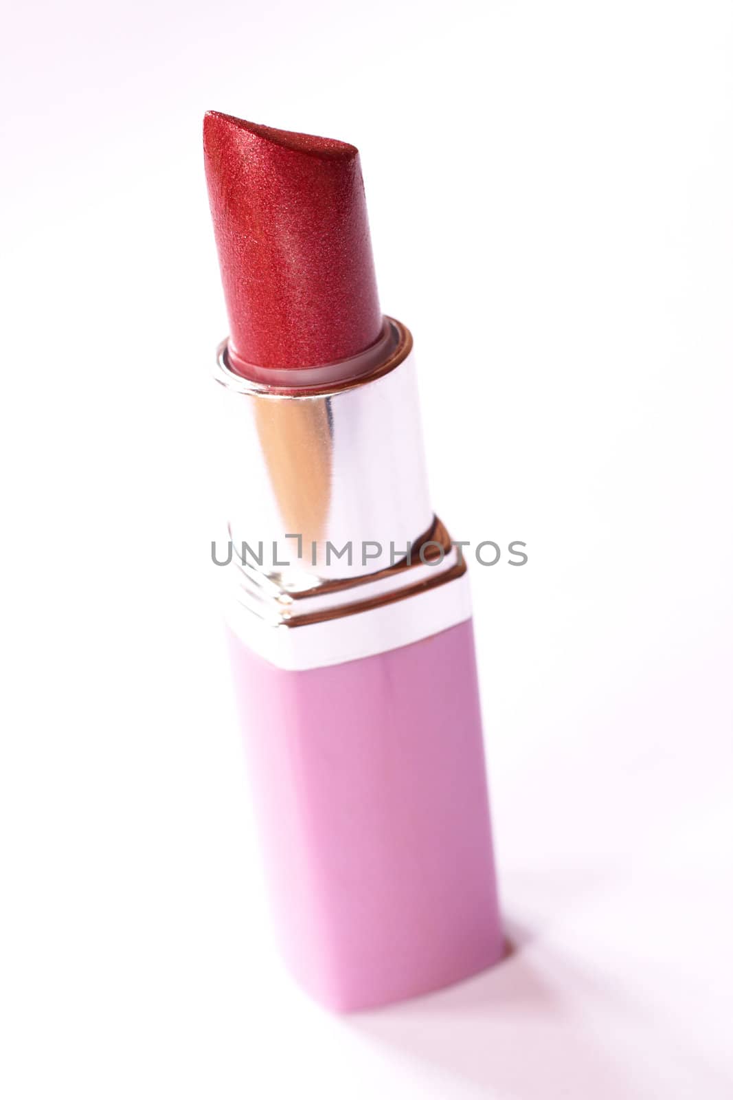 Red lipstick isolated on white background