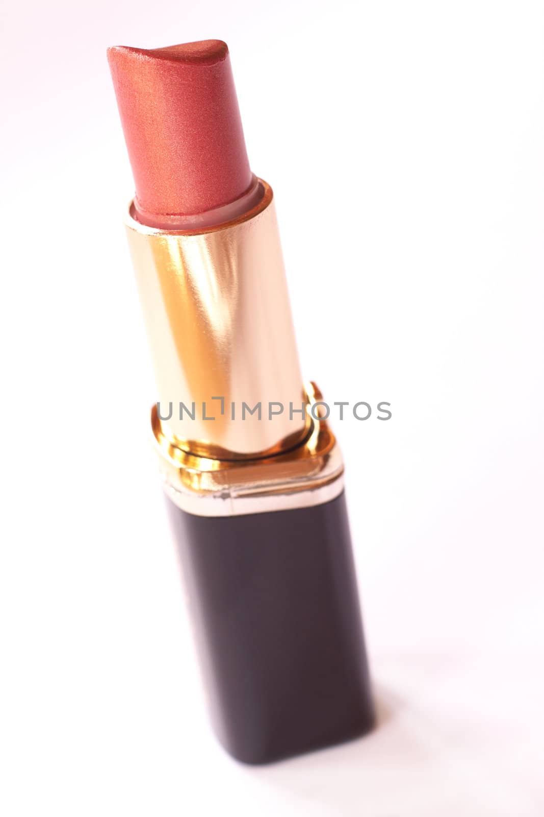 Orange lipstick isolated on white background