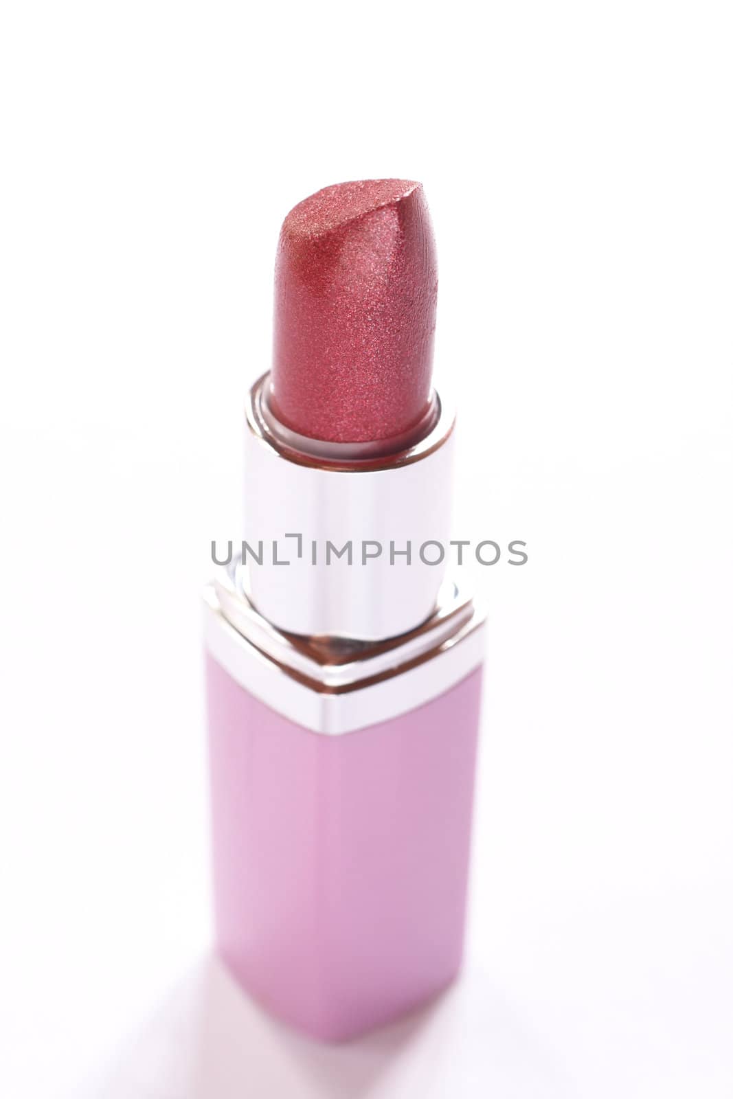 Pink lipstick isolated on white background