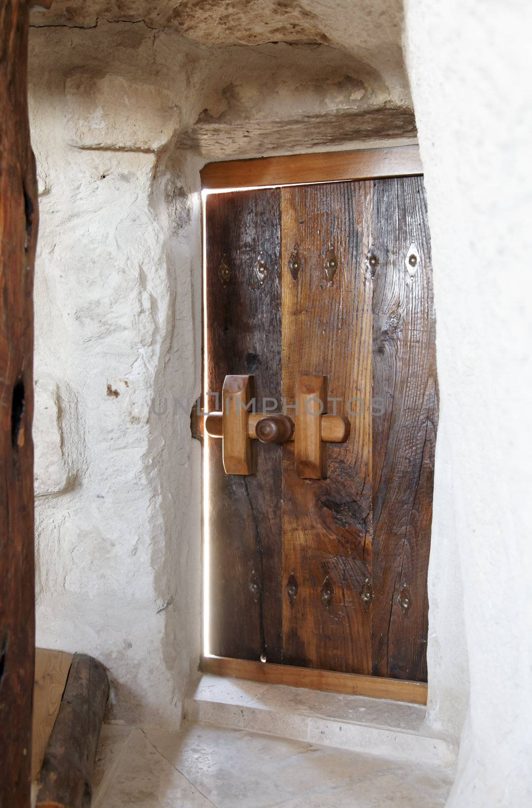 ajar doorway to a cave hotel room, Cappadocia, Gerome, Turkey, portrait