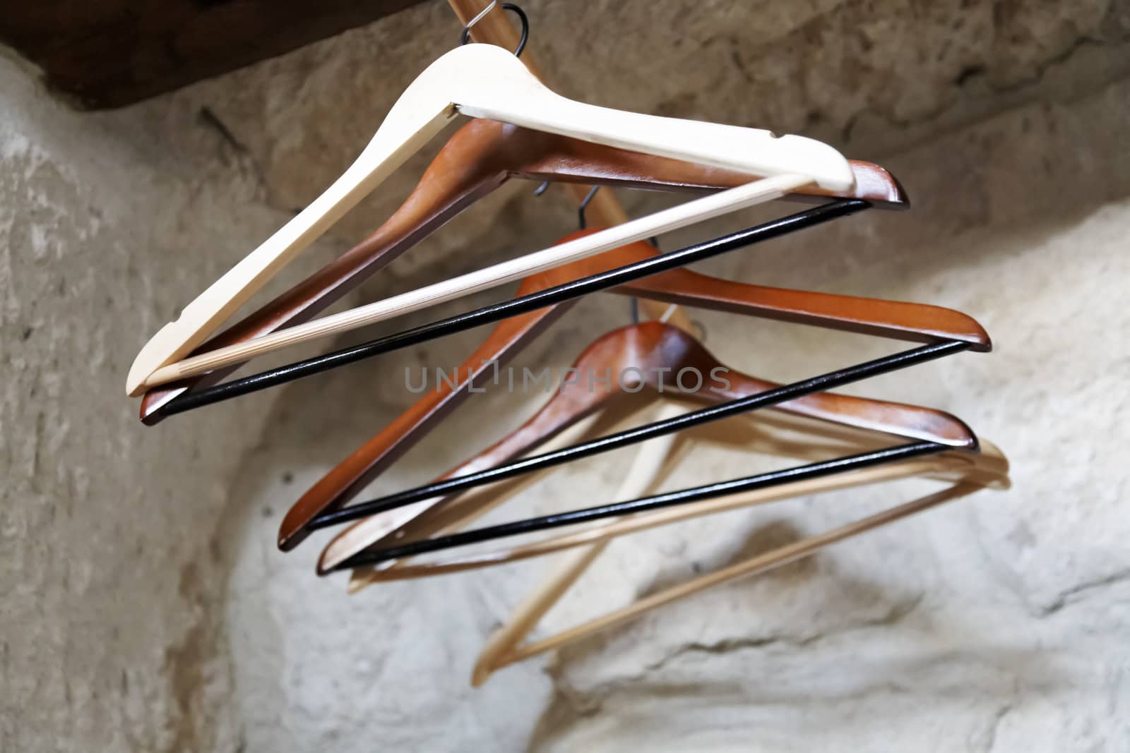 suit hangers on an alcove wardrobe with a rail