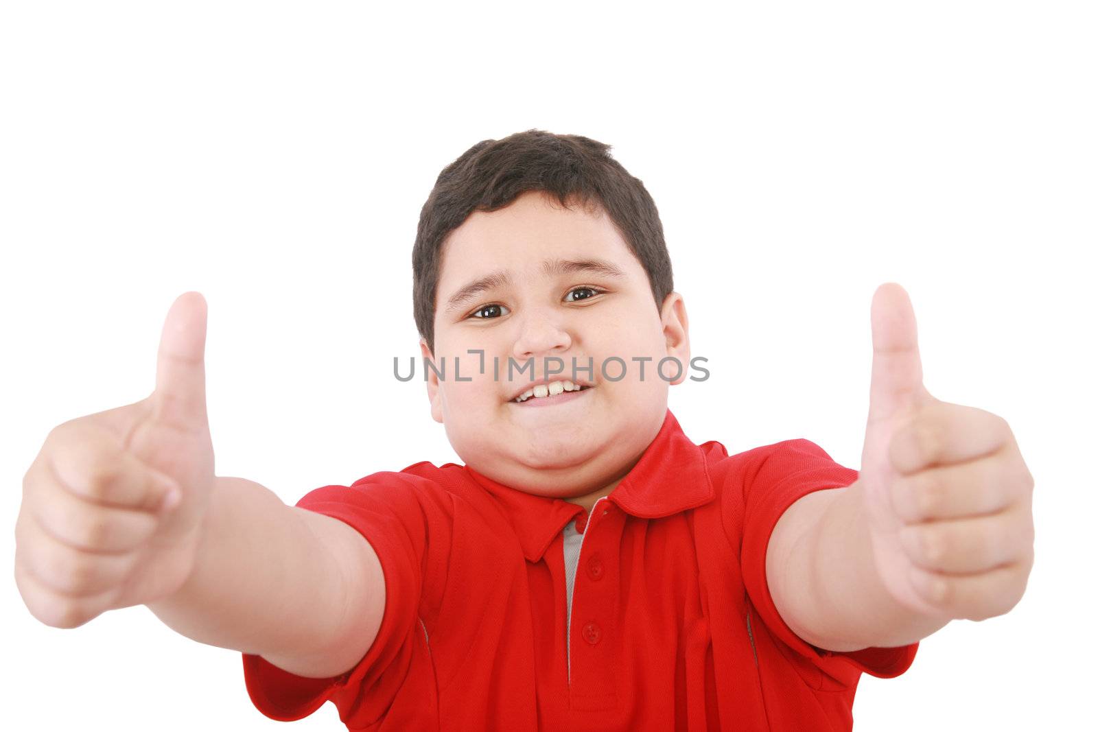 Thumbs up shown by a happy young boy