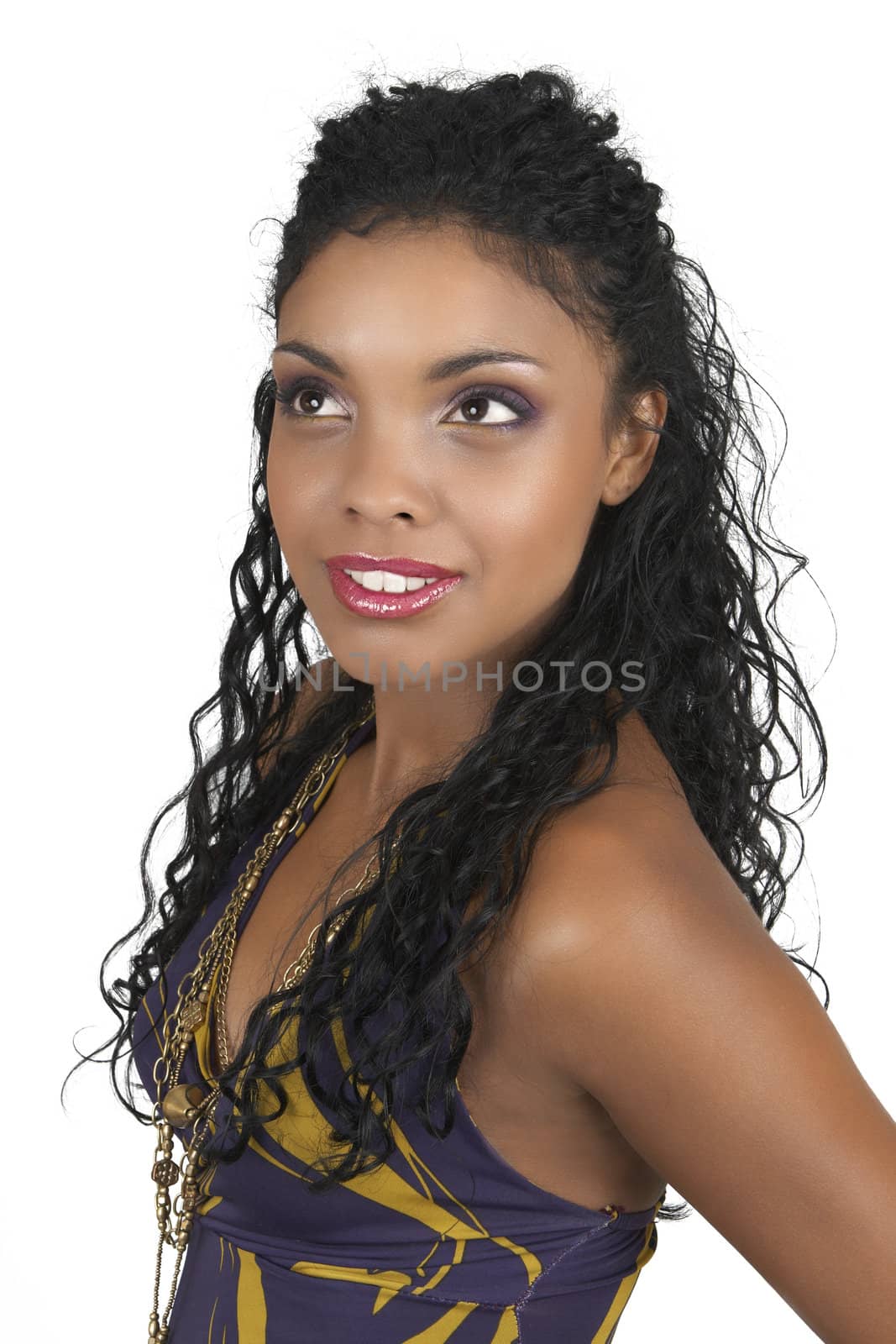 Beautiful brunette woman wearing purple party dress and accessories smiling on white background. 