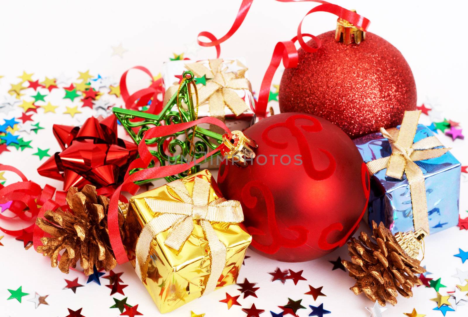 Red Christmas baubles and other decorations on white background 