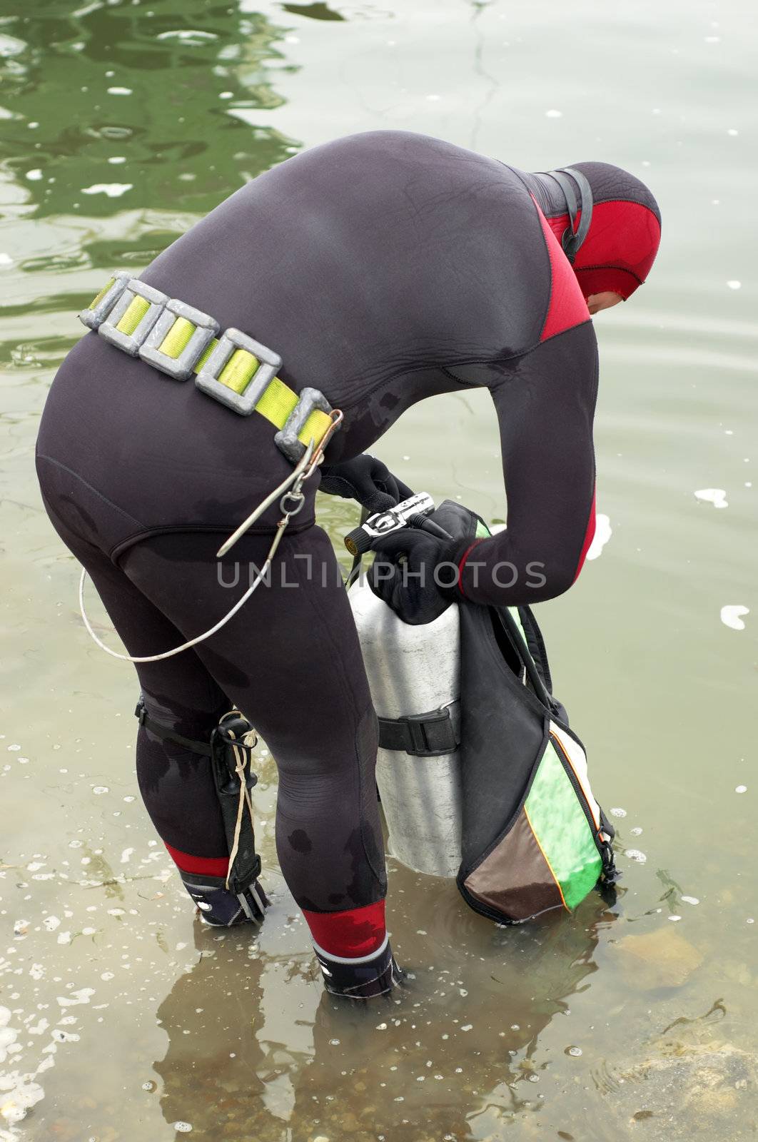 scuba diver in wet suit by starush