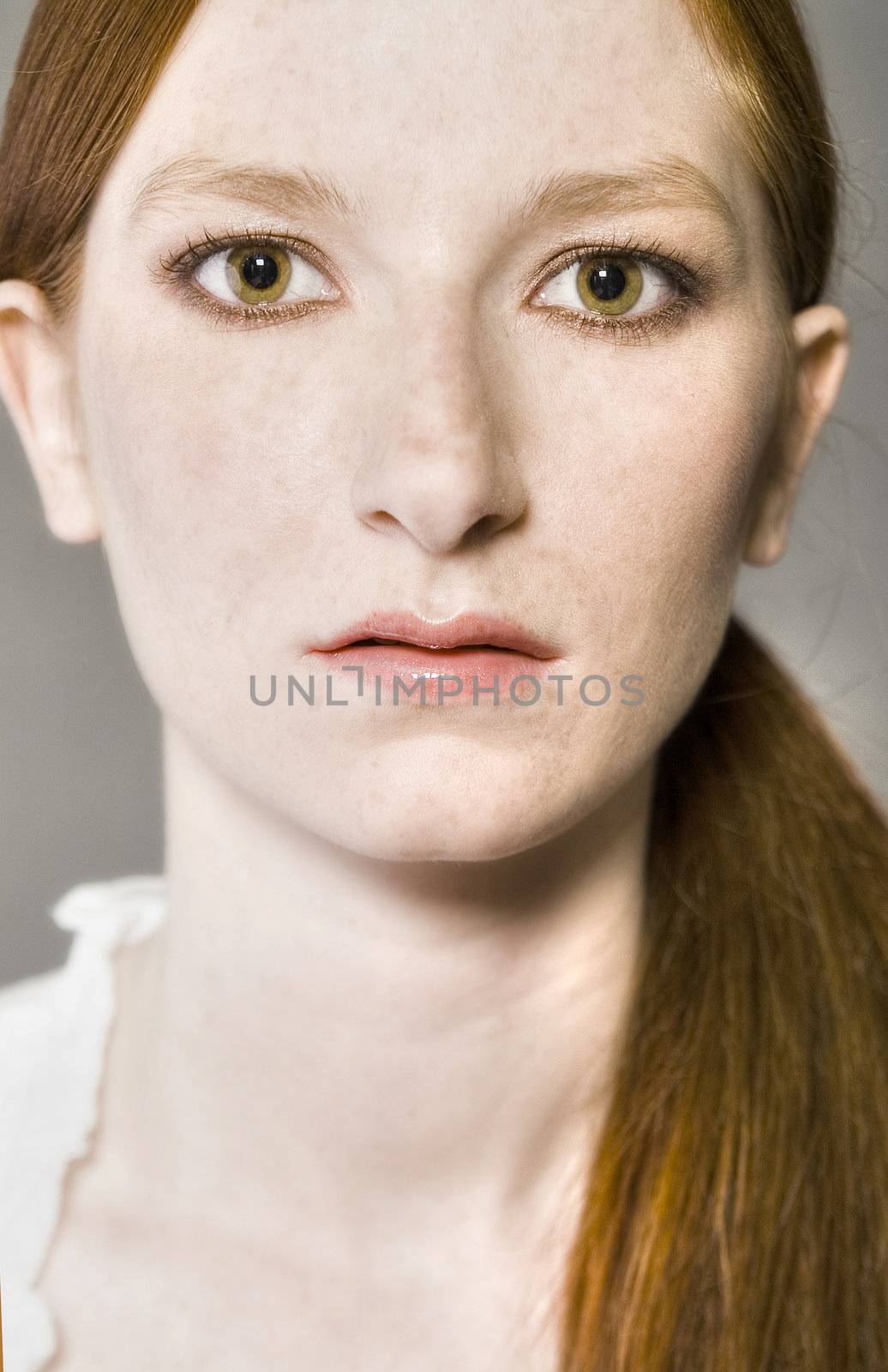 Classic studio portrait of a natural redhead