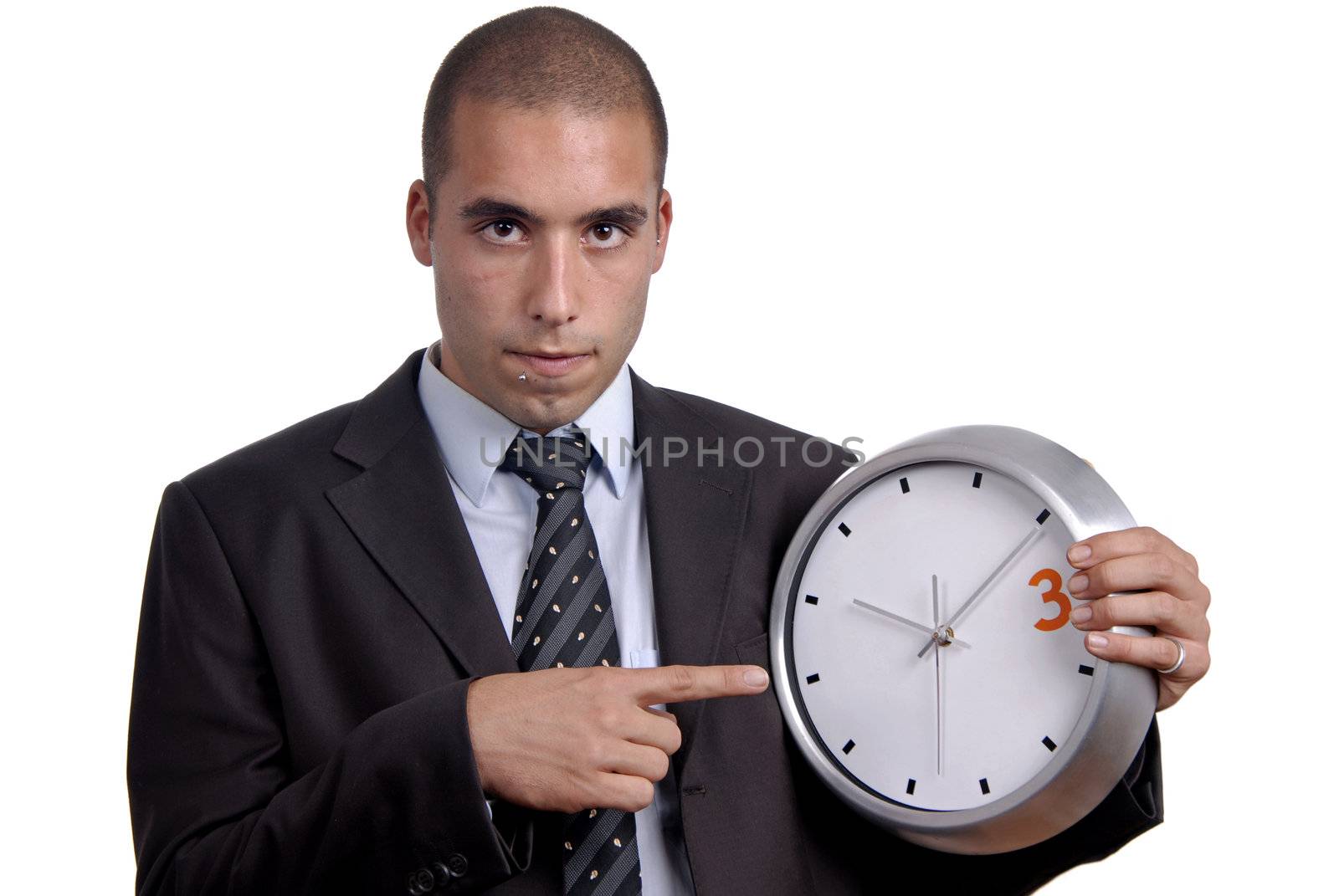 young handsome business man holding a clock