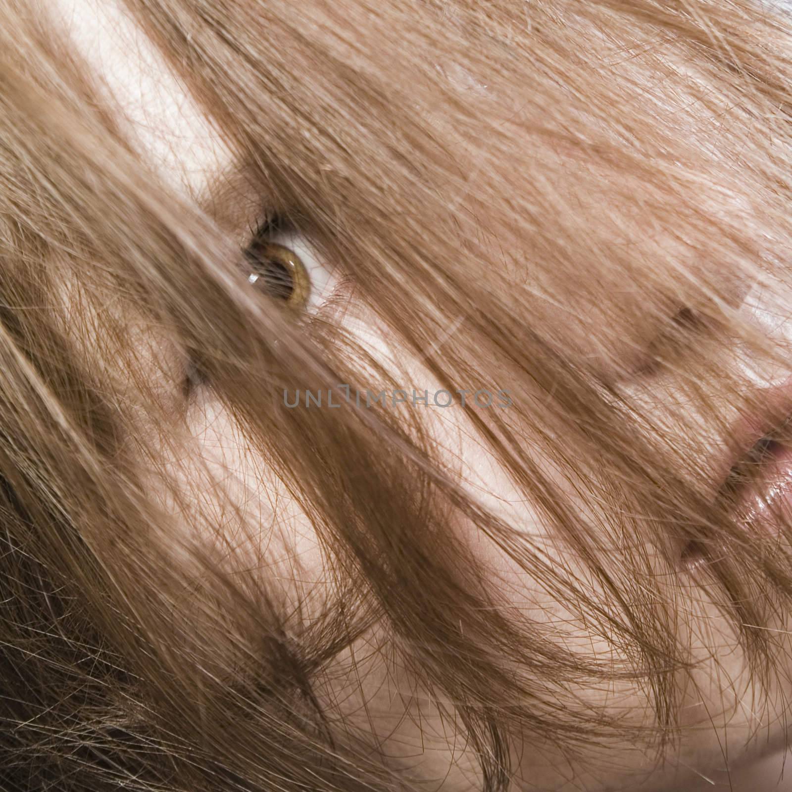 Redhead hiding behind her own hair by DNFStyle