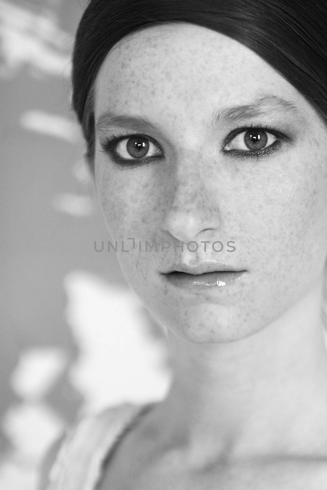 Studio portrait of a natural redhead with freckles