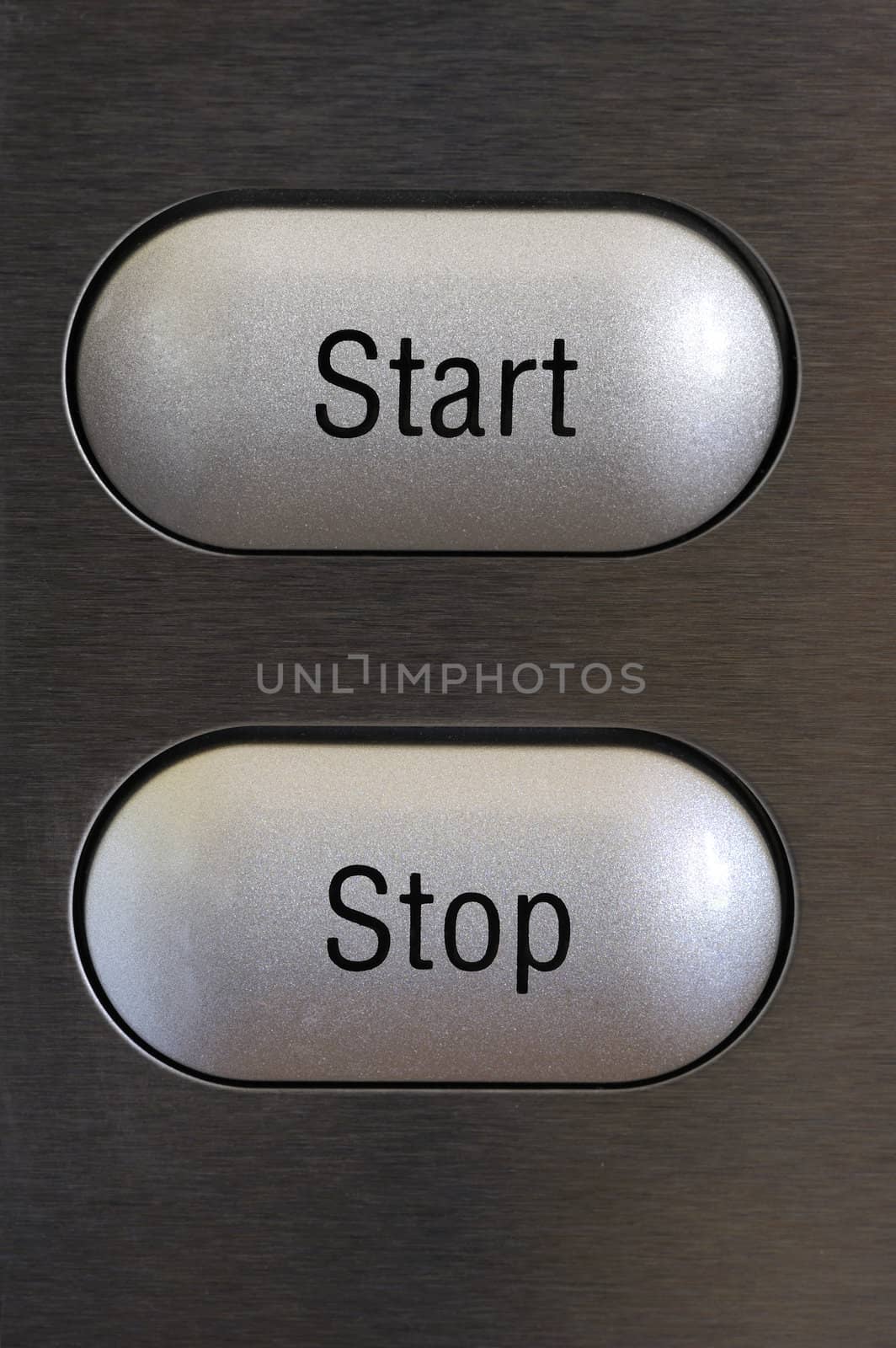 Stop and start buttons on a textured grey background.
