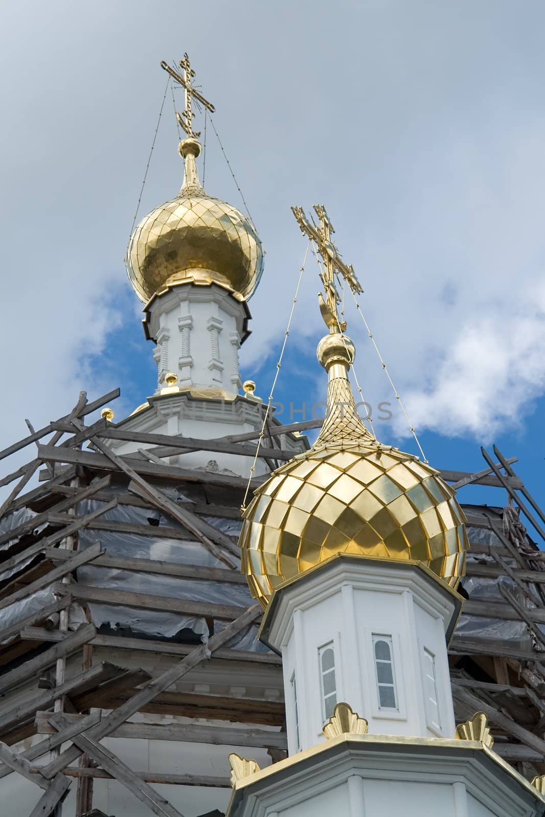 cupolas of orthodox temple with sky at background