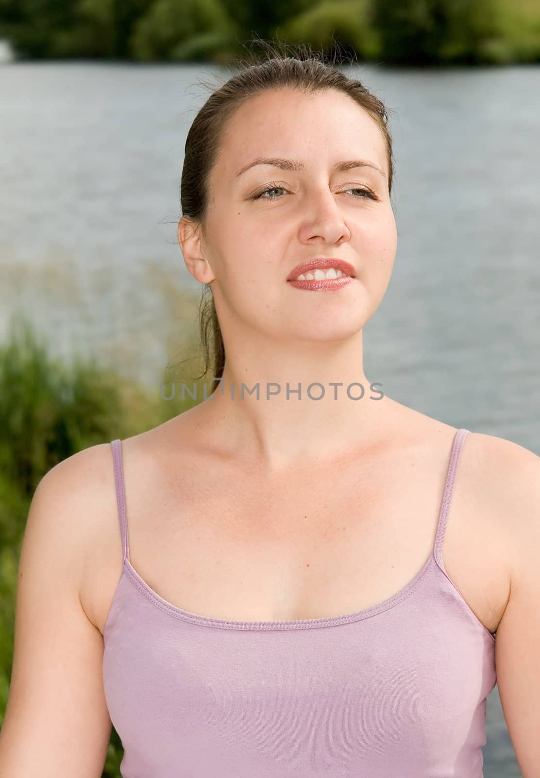half-length portrait. young woman smiles. Outdoor