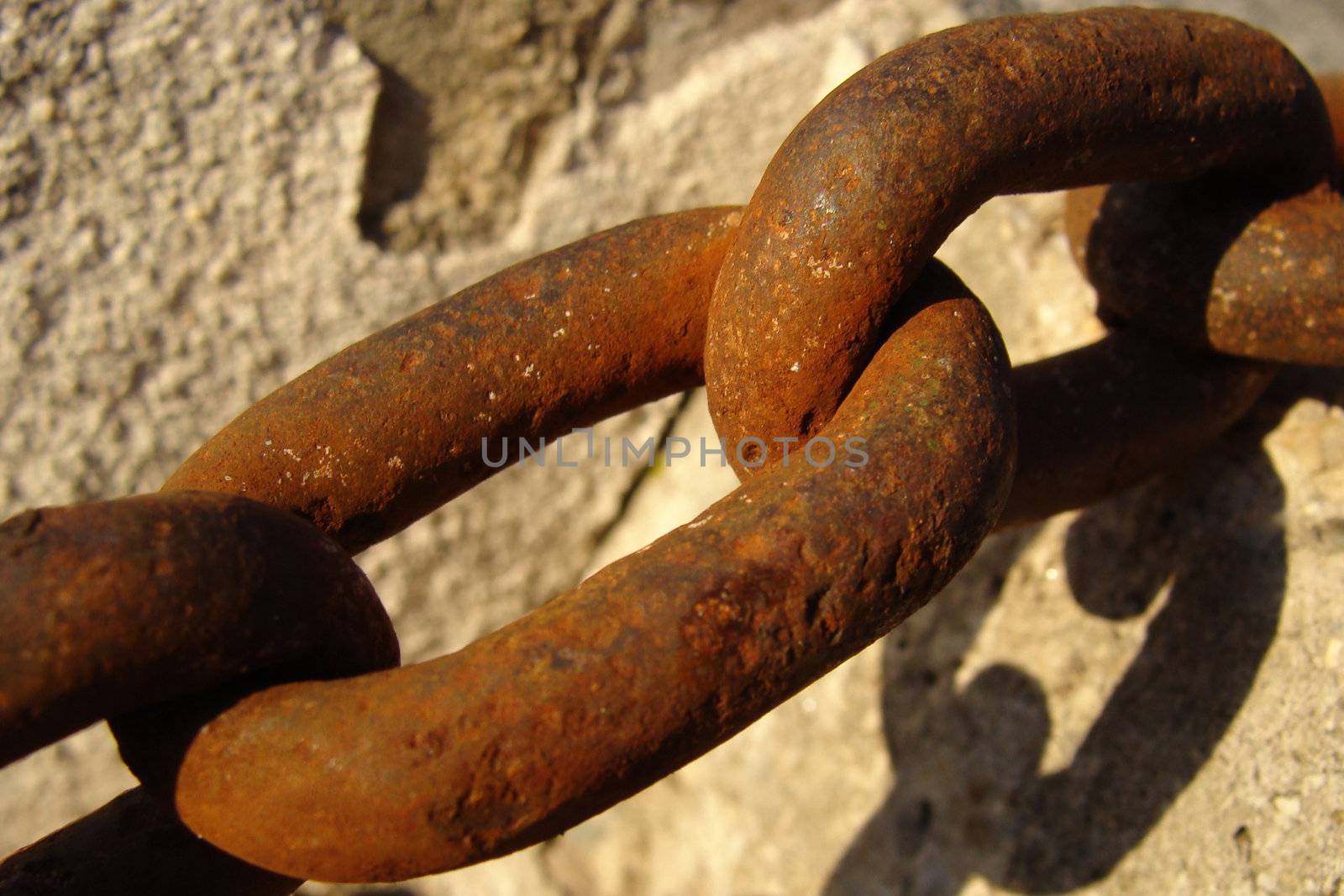 a detail of an old and rusty chain