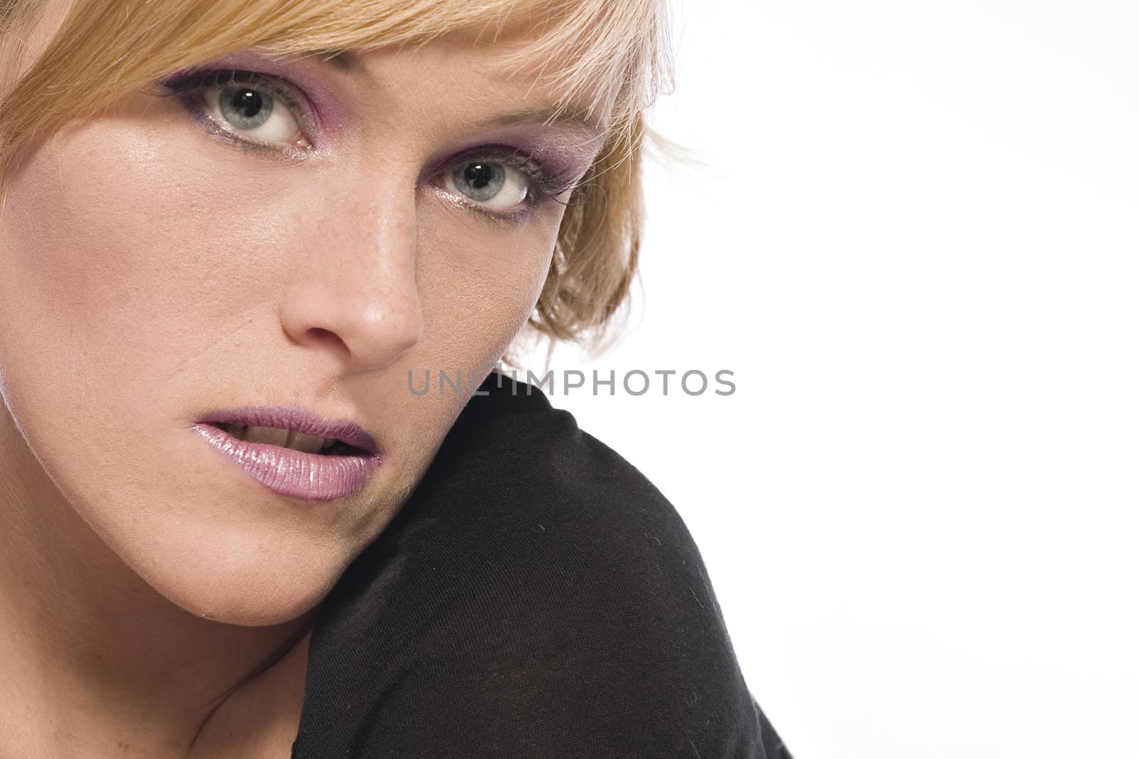 Studio portrait of a red haired model looking questionable