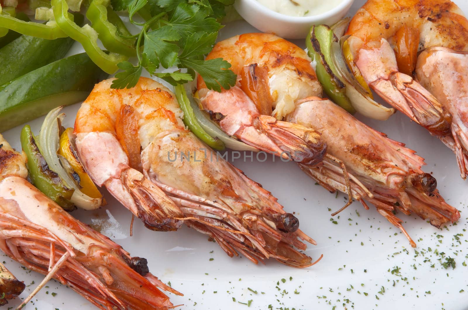 large grilled shrimps served on plate with vegeables, selective focus