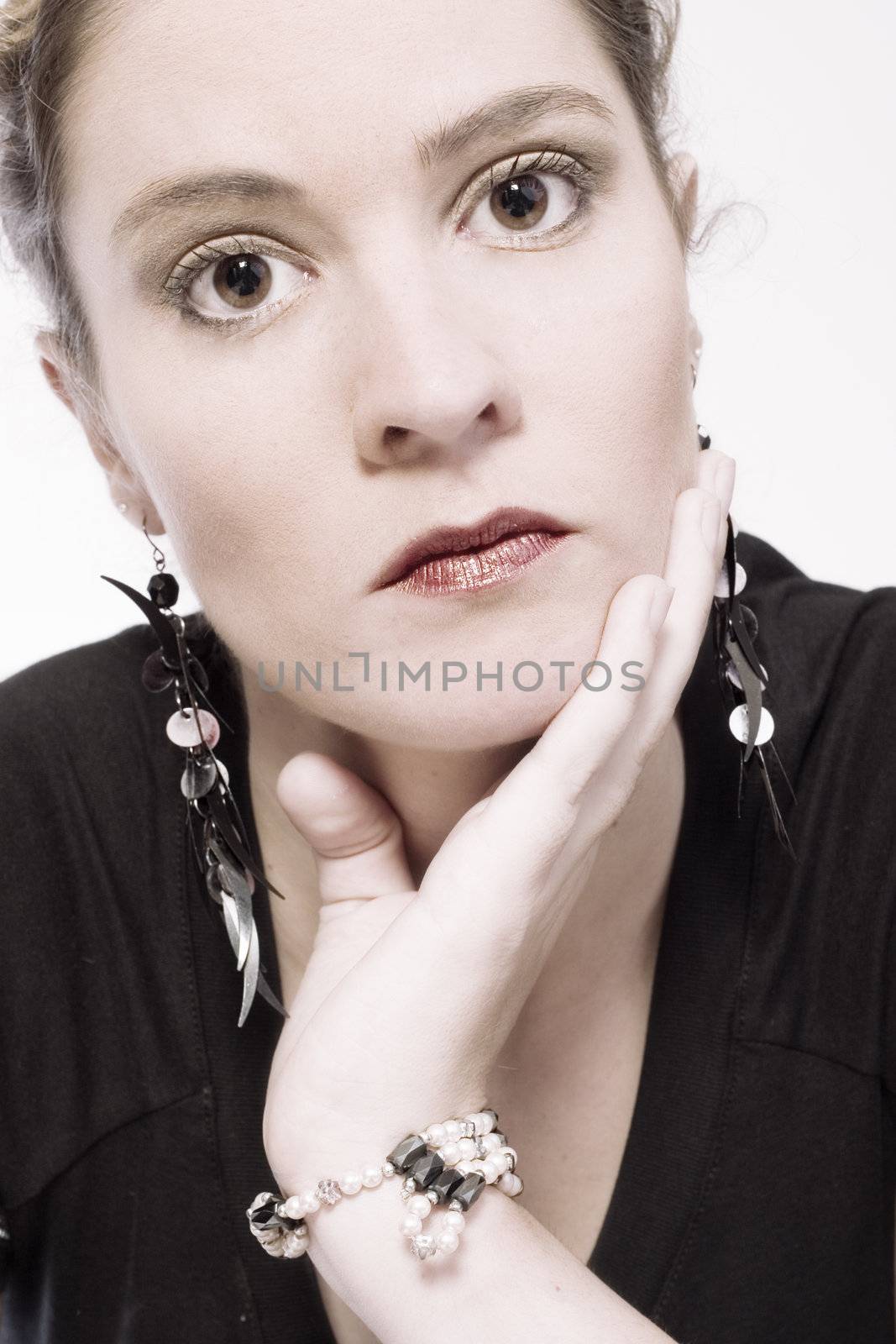 Studio portrait of a young woman looking interested