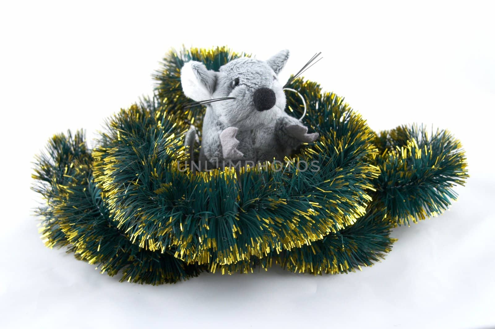 The grey toy mouse sitting in a tinsel