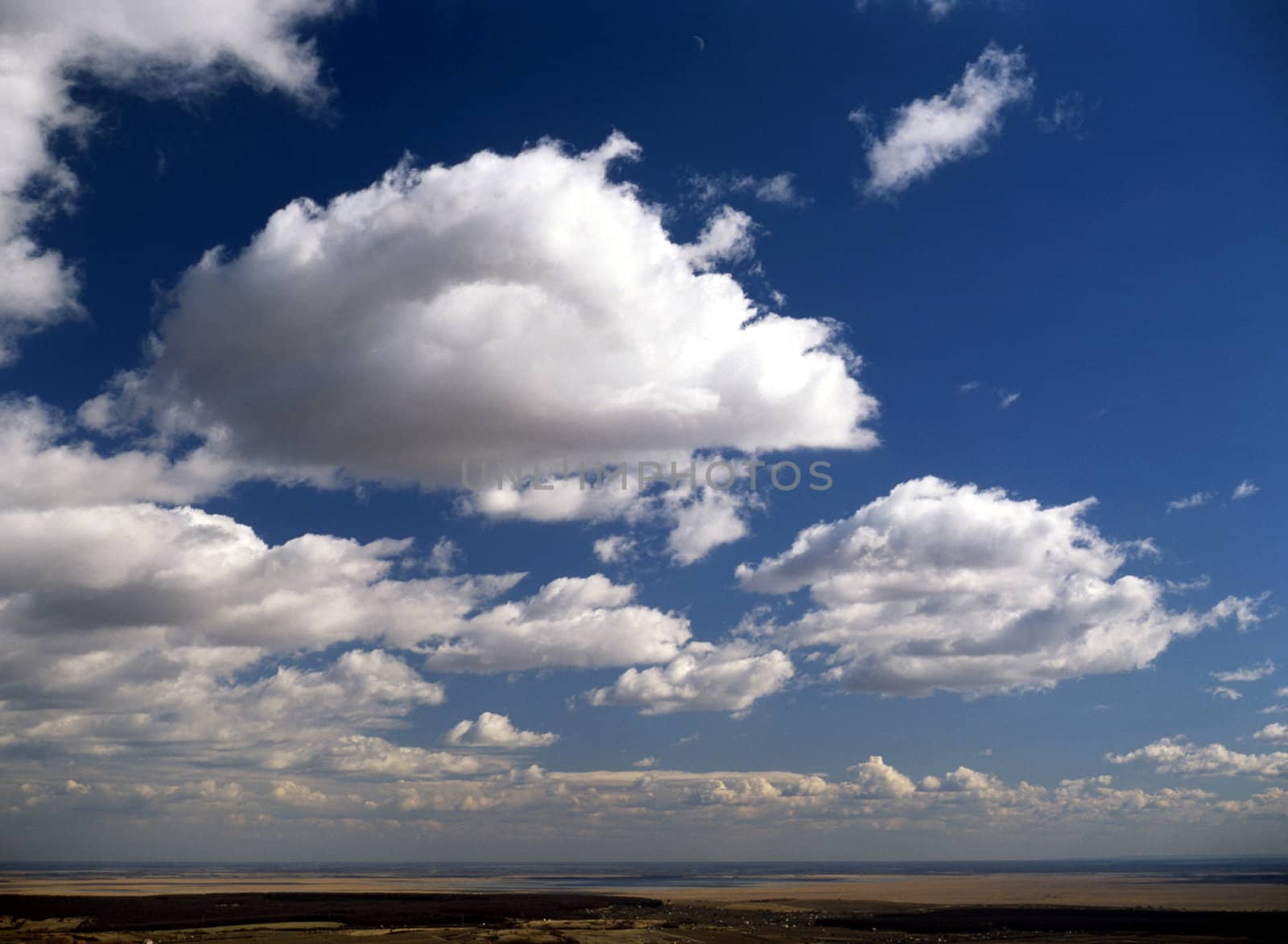 Cumulus clouds over landscape