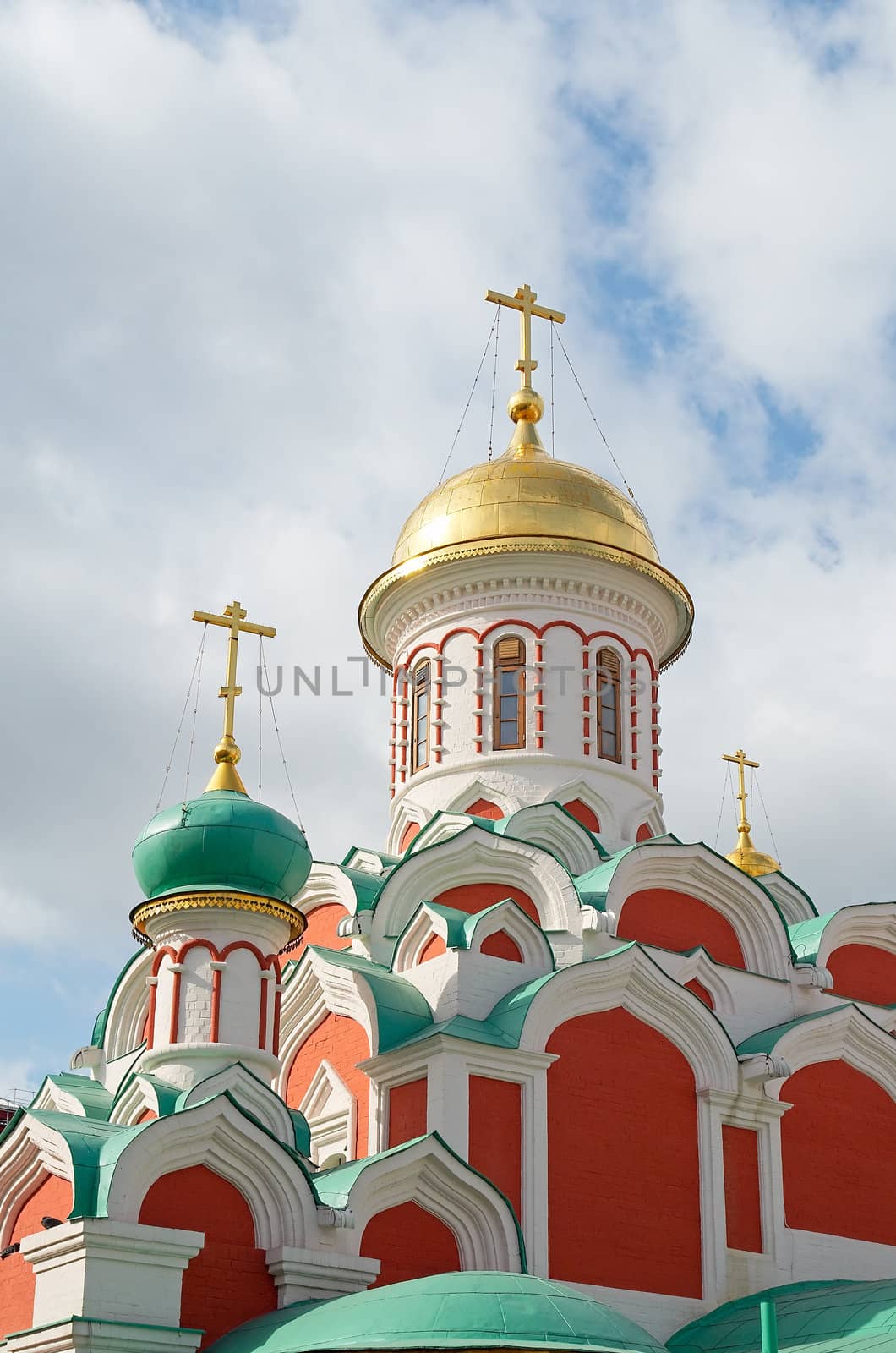 Domes of an orthodox temple on a background of the cloudy sky