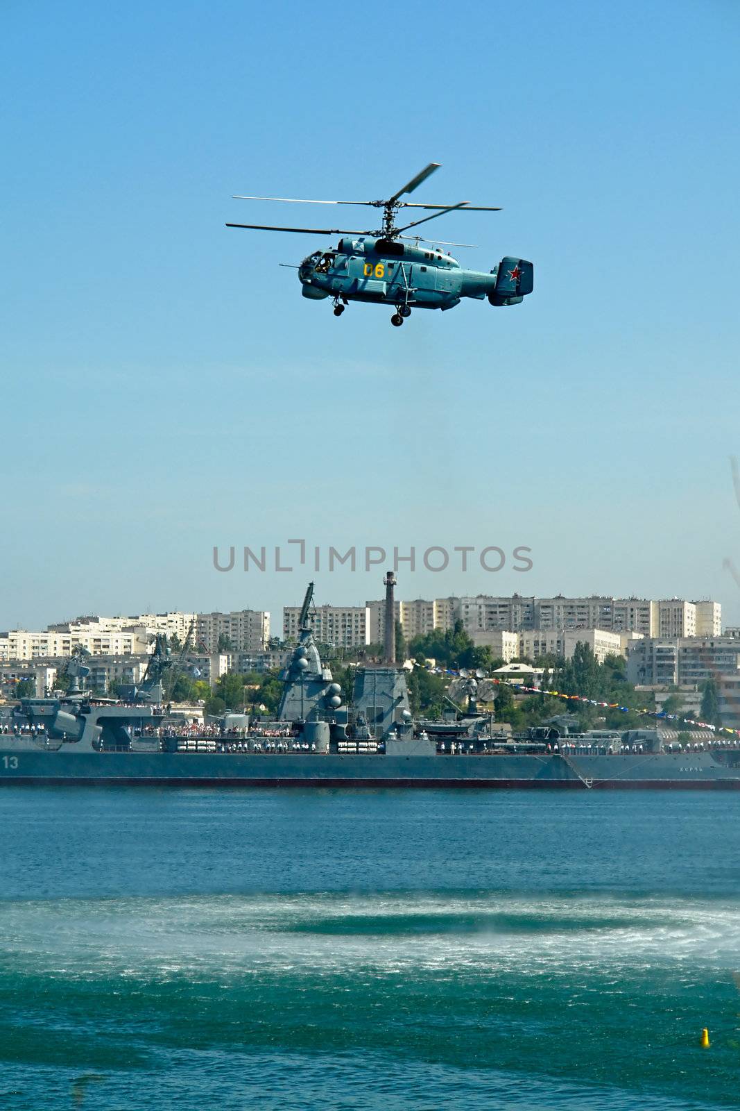 The helicopter has hanged on a surface of water                               