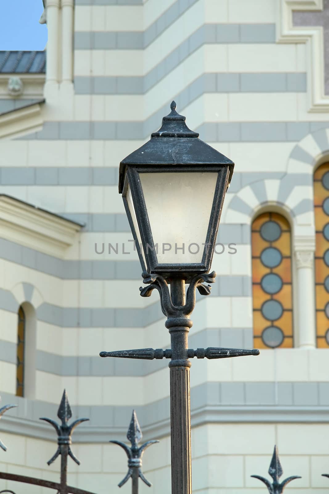 Street lantern on a background of church                               