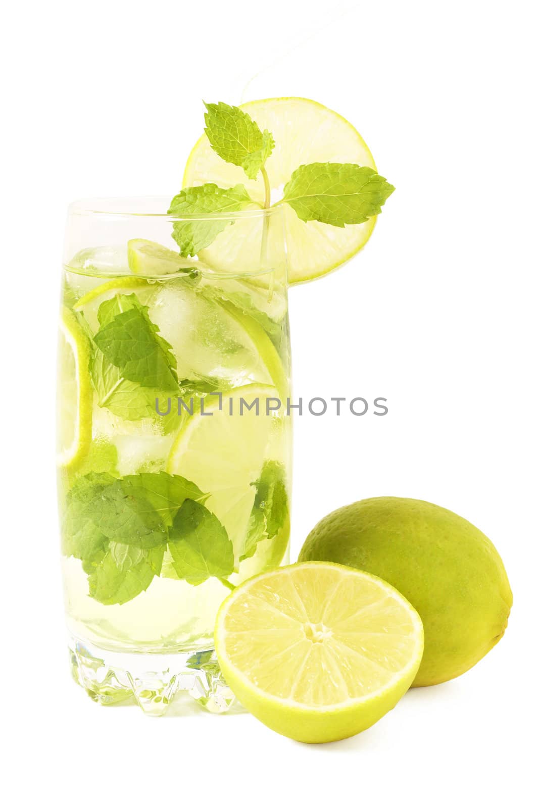 Mojito cocktail with lime, mint leaves and ice on white background