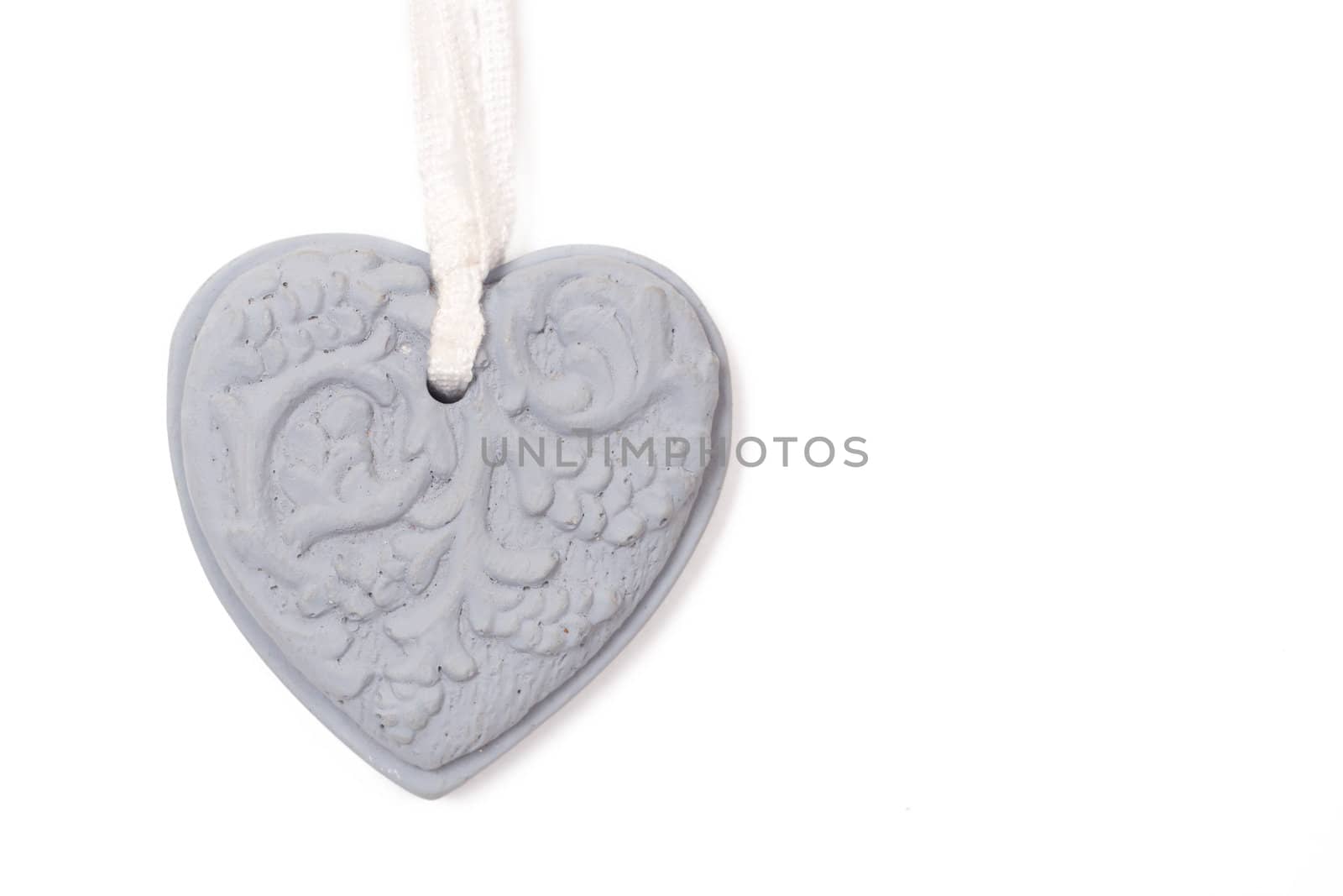 Grey stone heart with patterns on white background