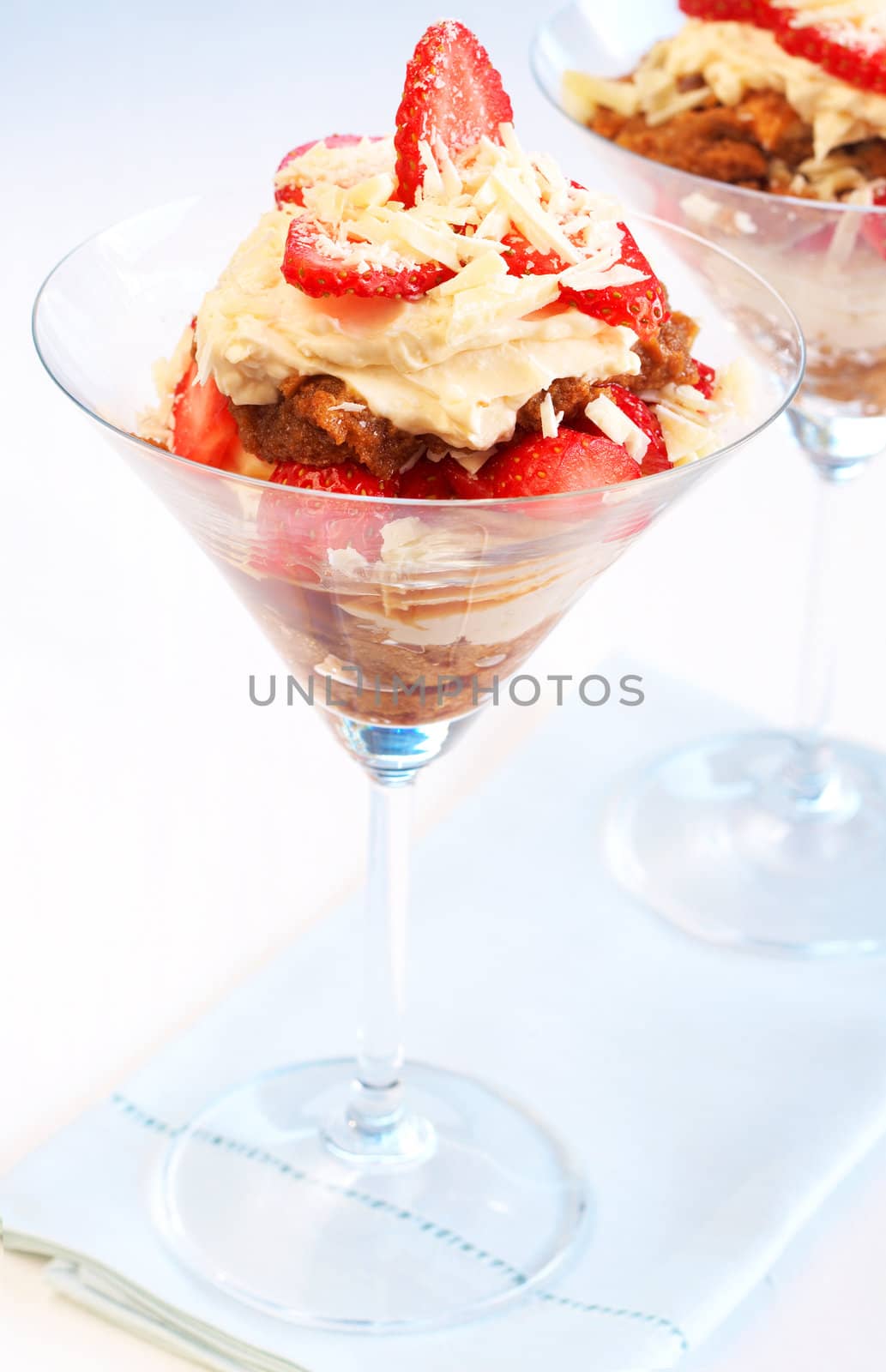 Italian dessert strawberry and mascarpone tiramisu in tall glasses