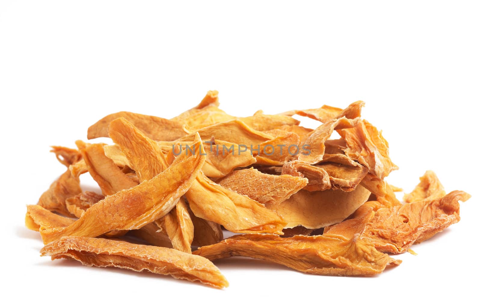 Stack of dried mango slices isolated on white background