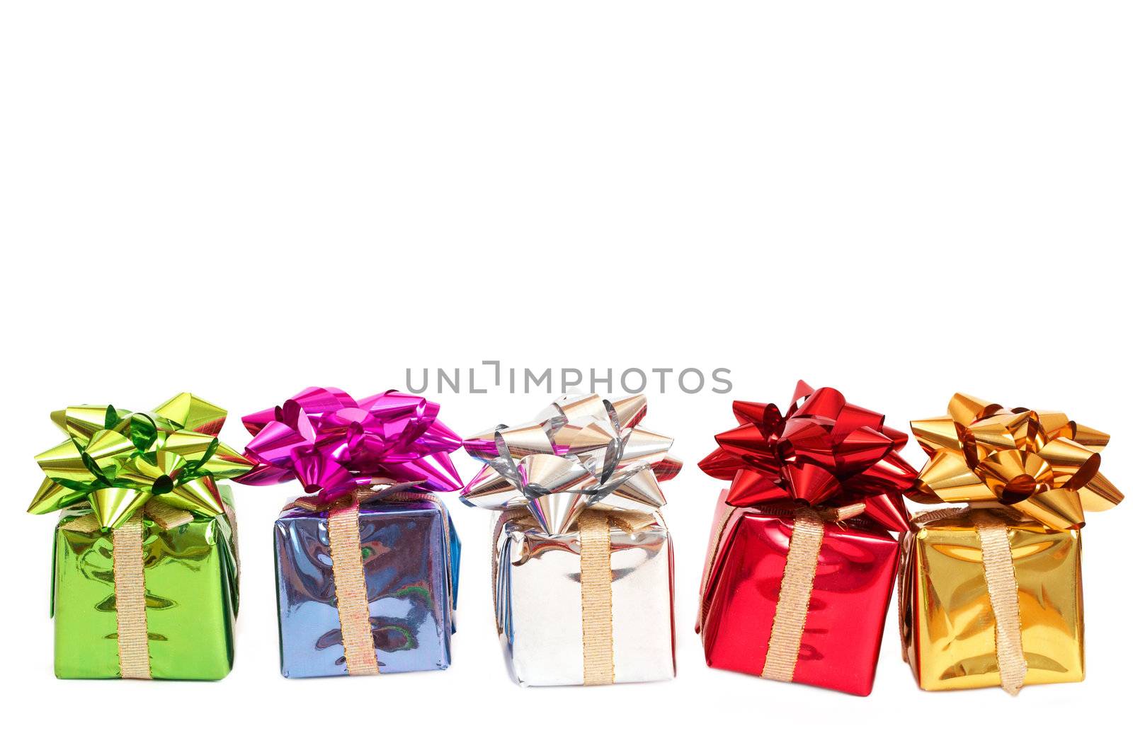 Colorful gift boxes with a bows for Christmas or Valentines Day isolated on white background with copy space