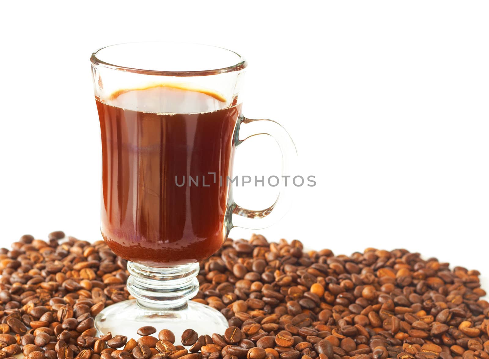 Cup of black coffee and roasted beans on white background with copy space