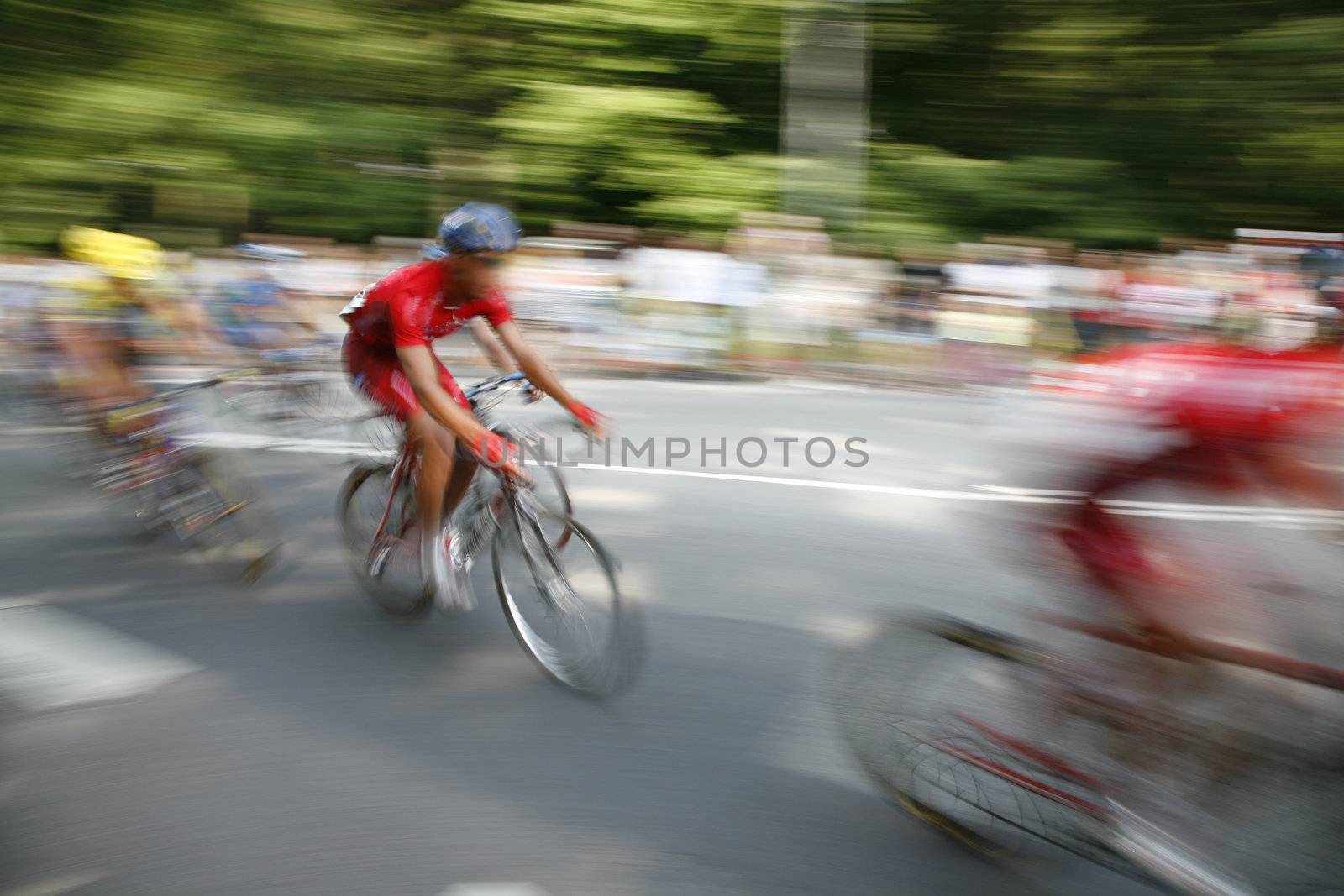 The cyclists riding by at the bicycle race Around Denmark