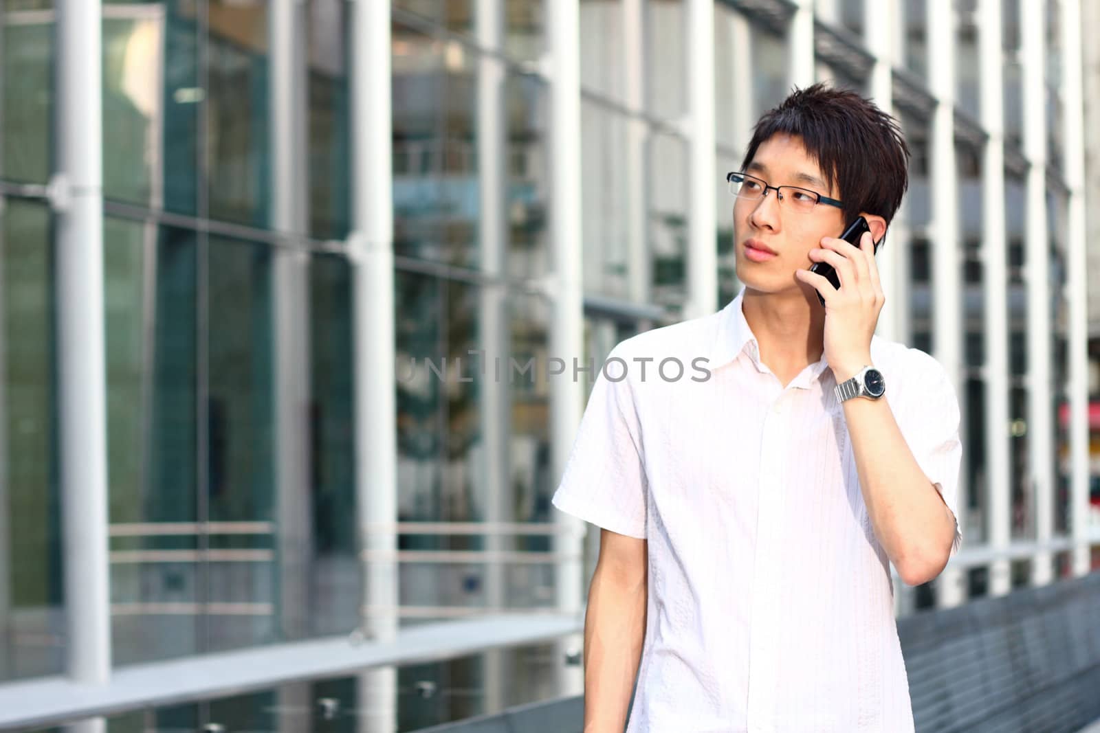 businessman talks with a mobile phone 