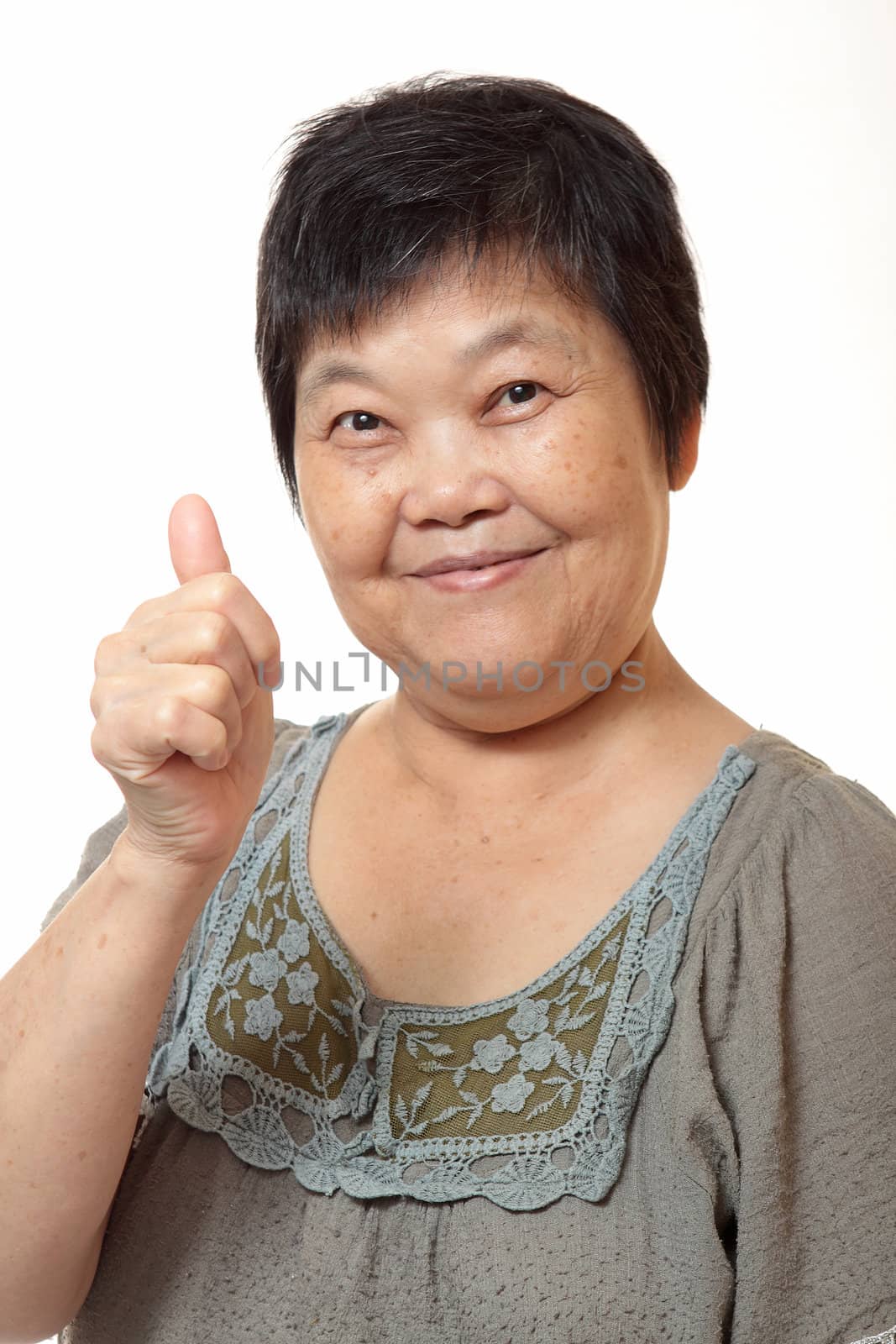 Happy Asian young woman give you an excellent gesture with friendly smiling face, half length closeup portrait on white background. 