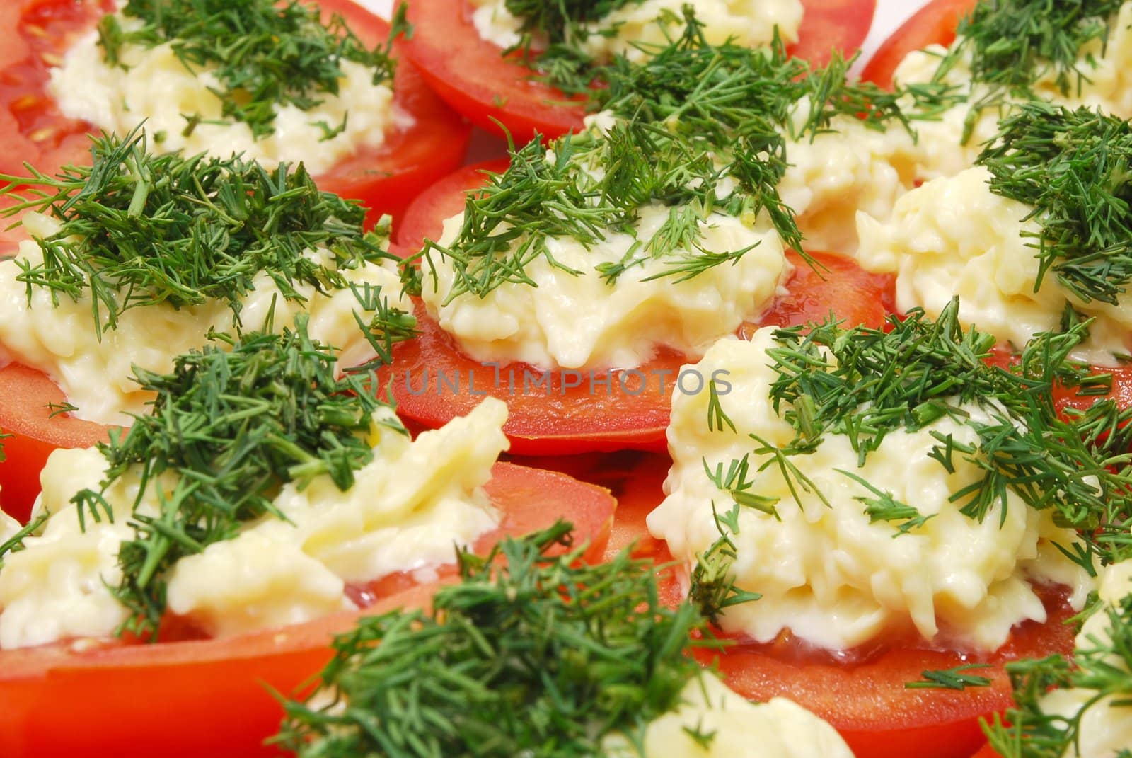 Dish of Red Tomato Slices with Horseradish and Chopped Parsley