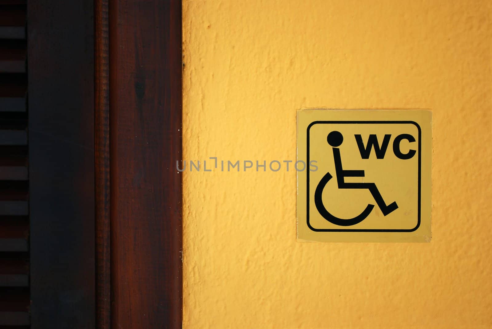 Invalid Lavatory Label on the Yellow Wall near the Door