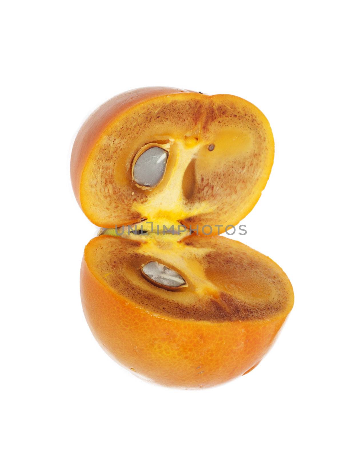 Two ripe halves of a persimmon