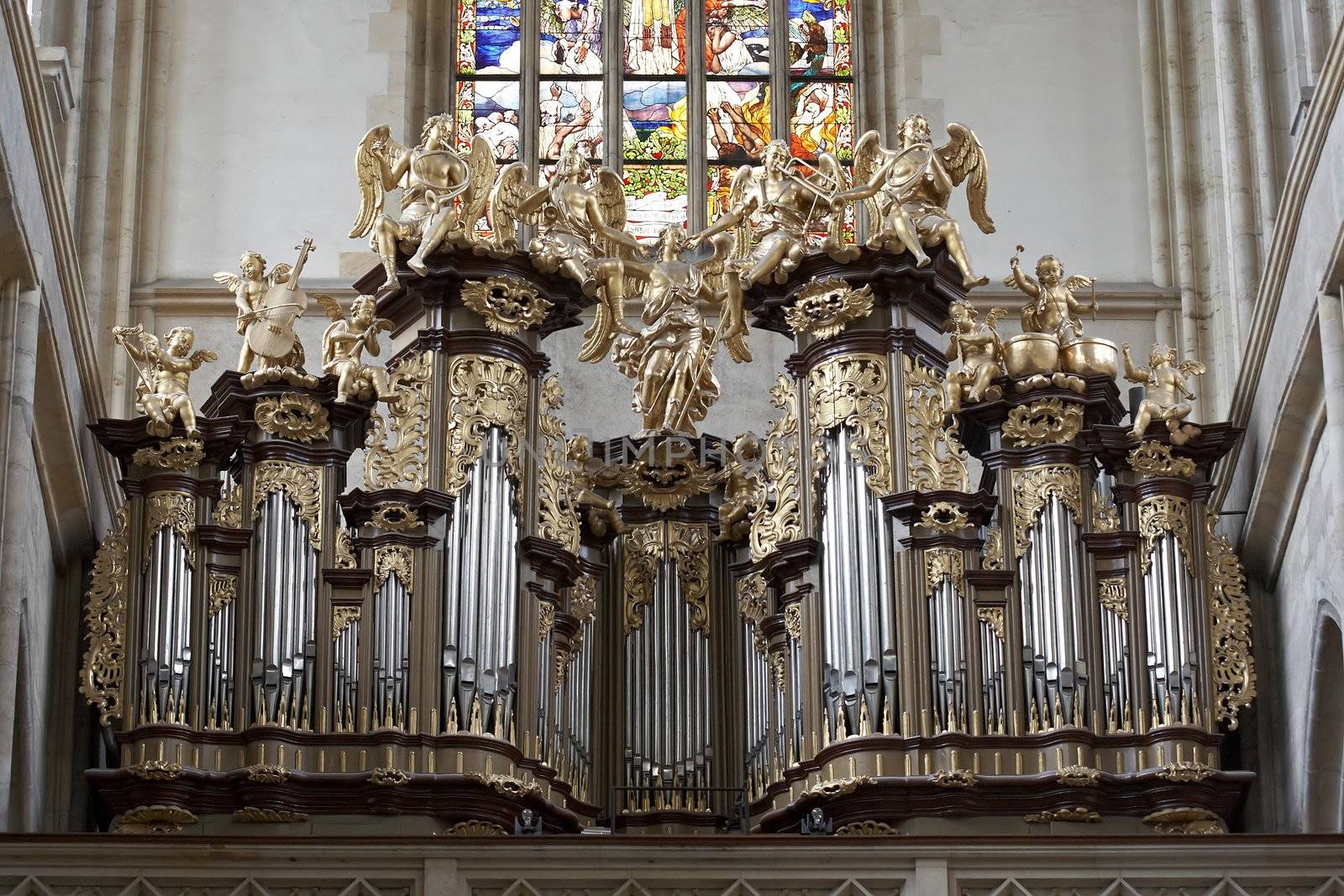Saint Barbara church - Organ Loft and Stained glass in the church.
Saint Barbara Church in Kutna Hora is one of the most famous Gothic churches in central Europe and it is a UNESCO world heritage site. St Barbara is the patron saint of miners (among others), which was highly appropriate for a town whose wealth was based entirely upon its silver mines.
Construction began in 1388.The first architect was probably Johann Parler, son of Peter Parler, but studies say that Peter Parler had participated at least as a co-author of the draft design. Work on the building was interrupted for more than 60 years during the Hussite Wars and when work resumed in 1482, Matej Rejsek and Benedikt Rejt, two architects from Prague, assumed responsibility.
