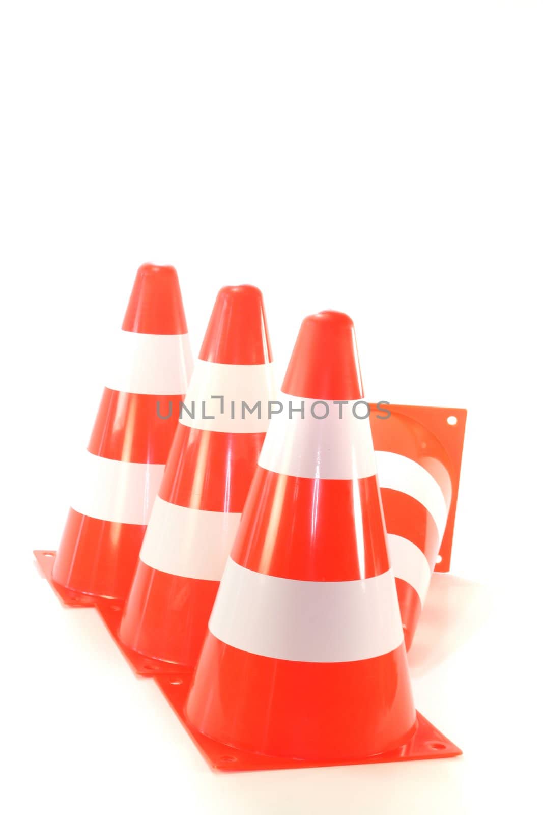 red and white pylons on a white background