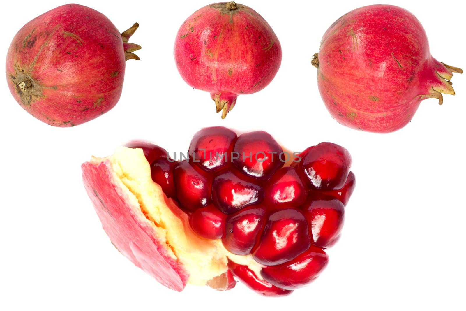 Extreme close up background of a red juicy ripe pomegranate fruit seeds 