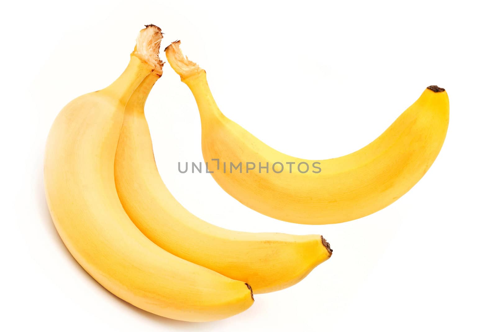 three mature bananas on white background