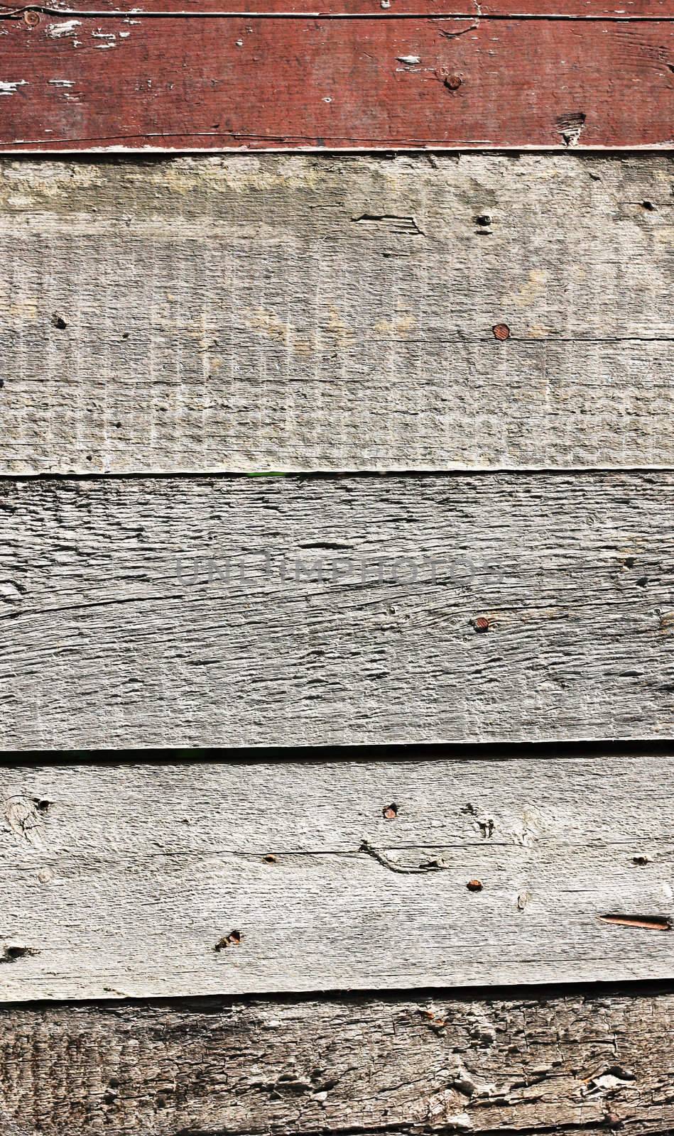 Close up of gray wooden fence panels  by schankz