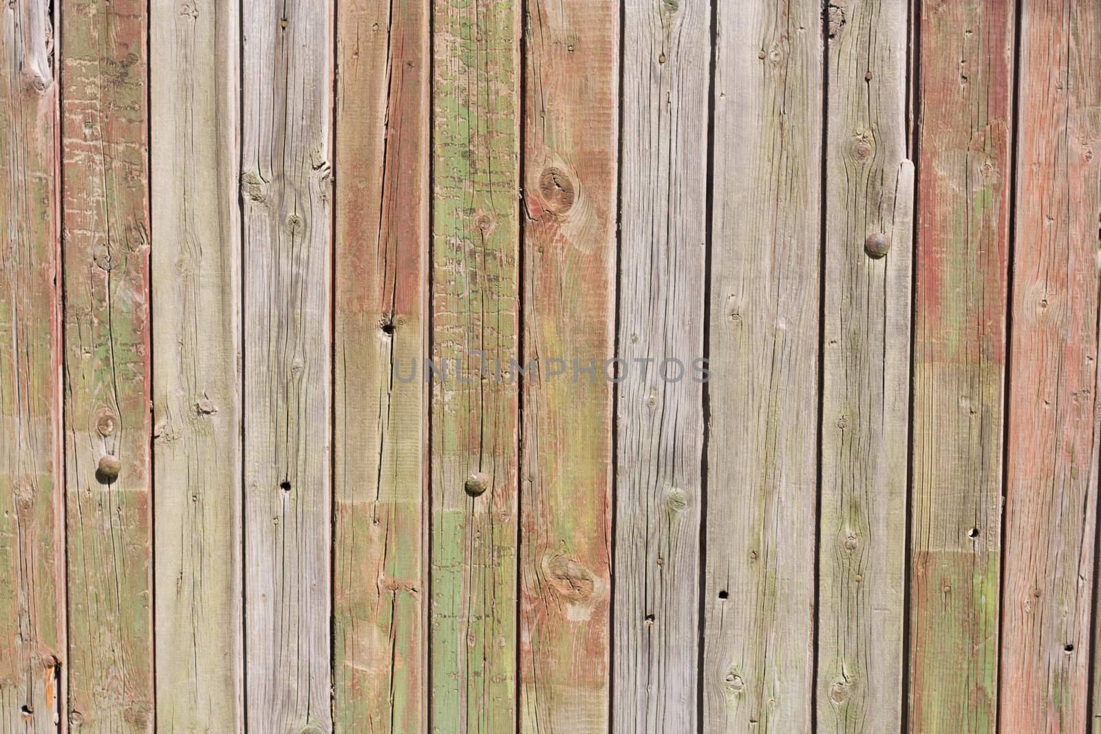 Close up of gray wooden fence panels  by schankz